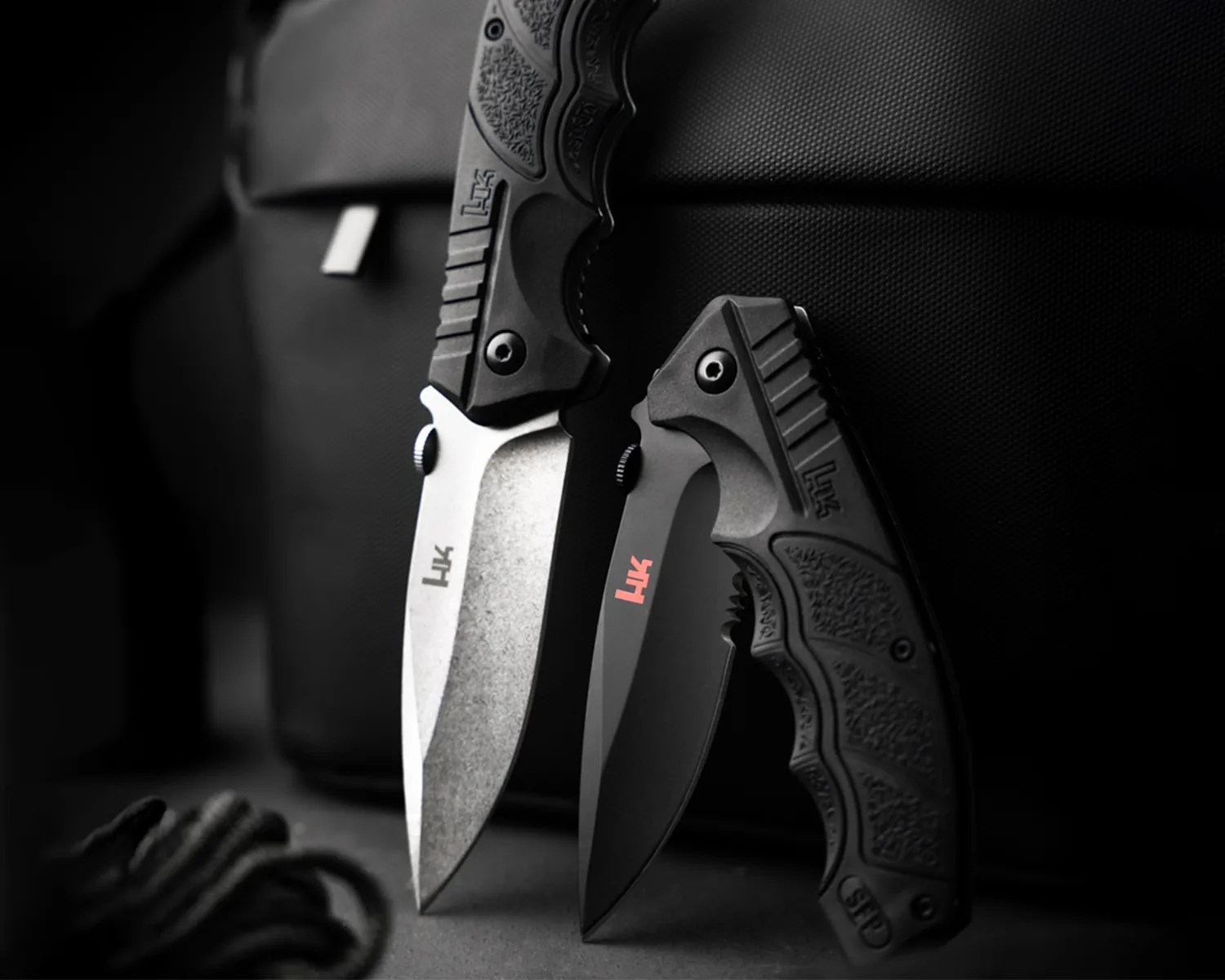 boker x heckler n koch sfp tactical folder deployed and half folded
