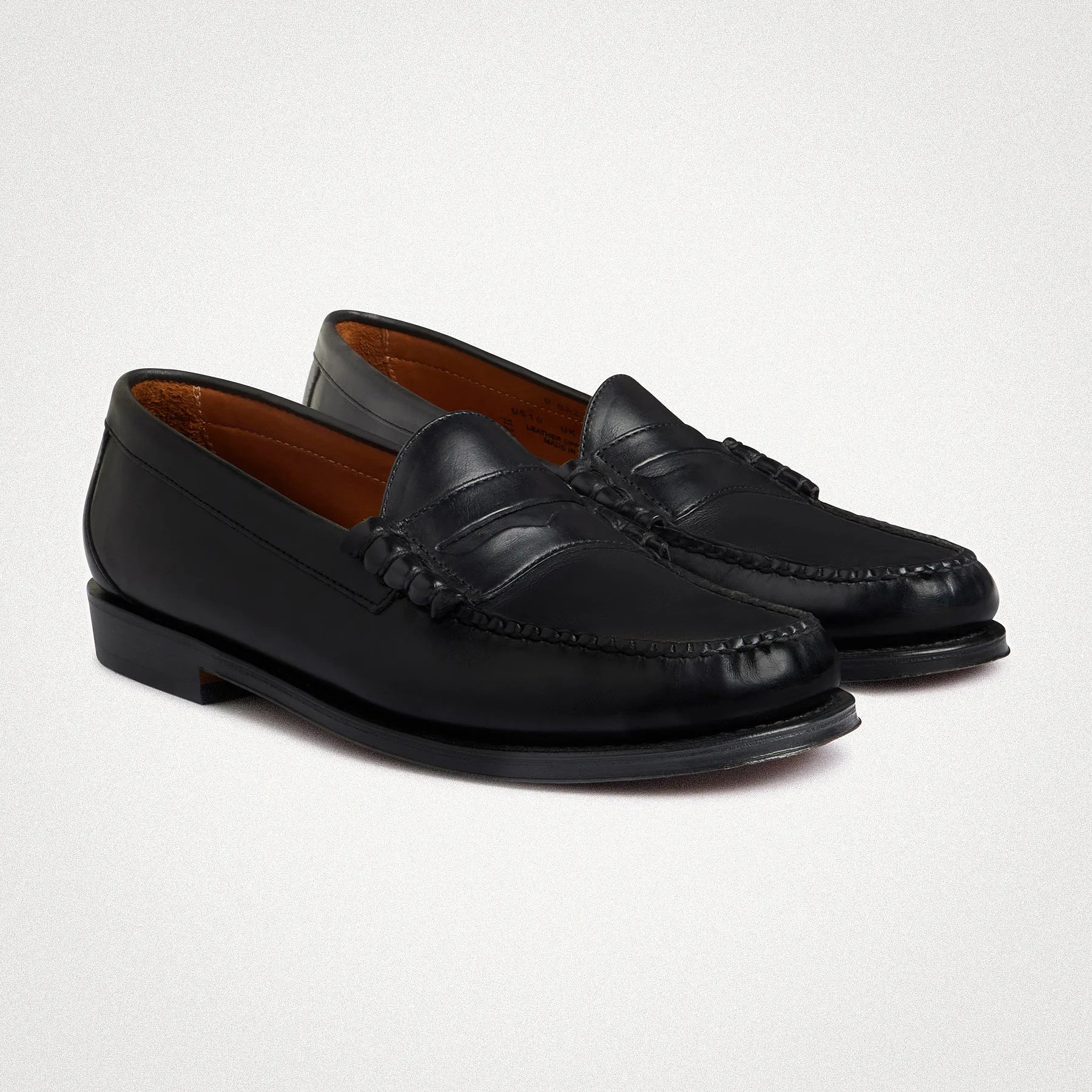 a pair of black penny loafers