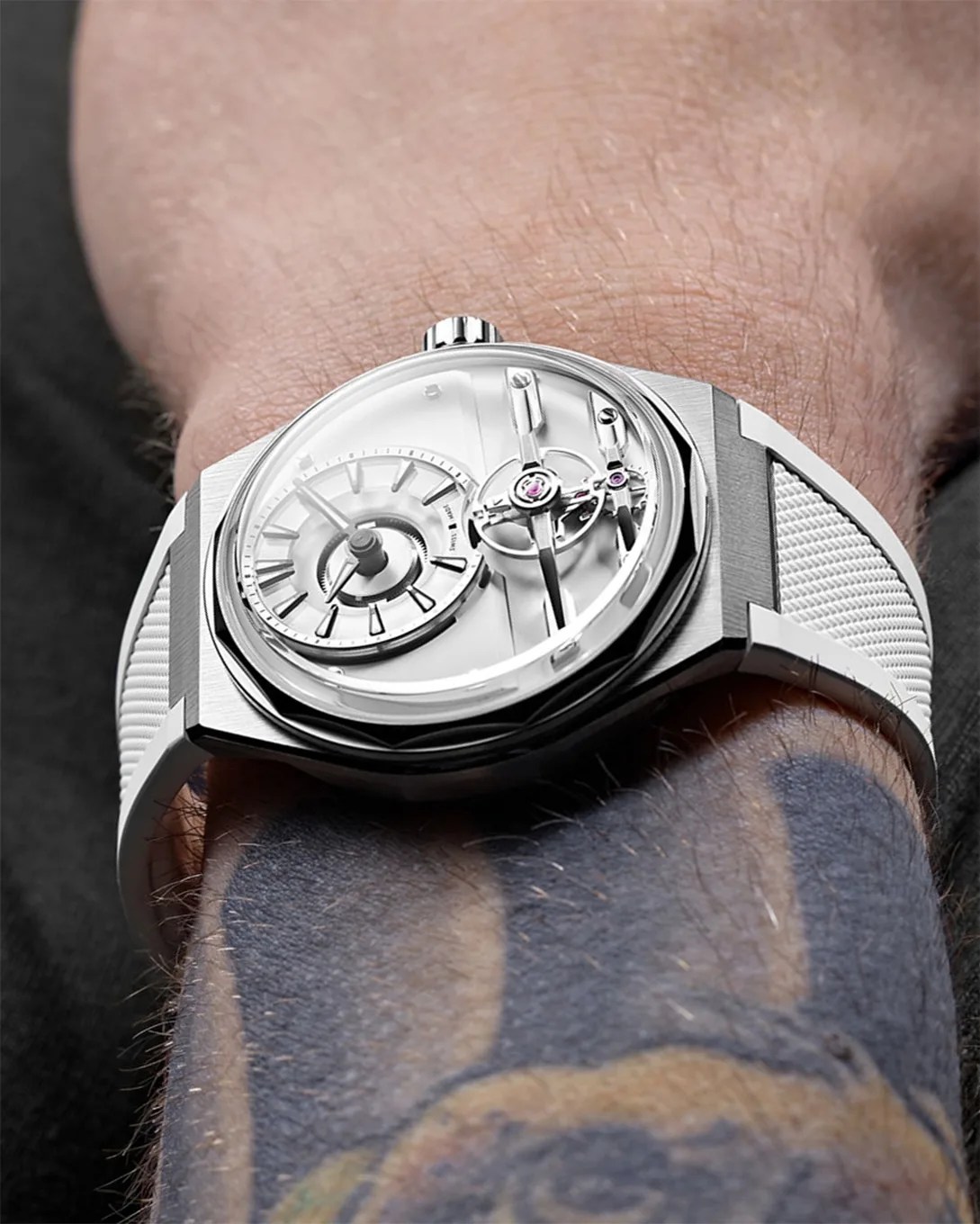 a white watch on a man's wrist