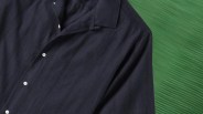 a navy blue camp collar shirt