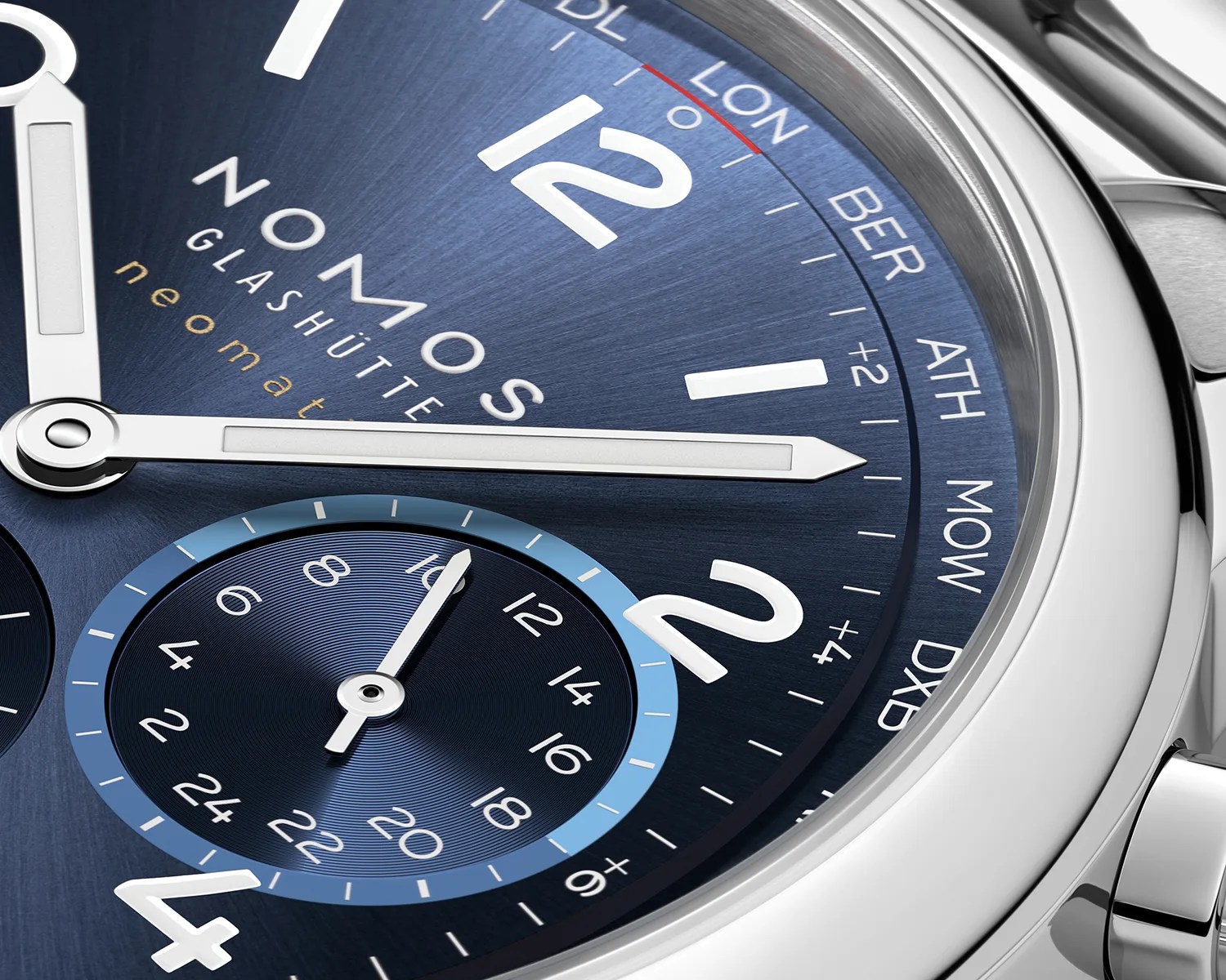 a closeup of a nomos watch dial