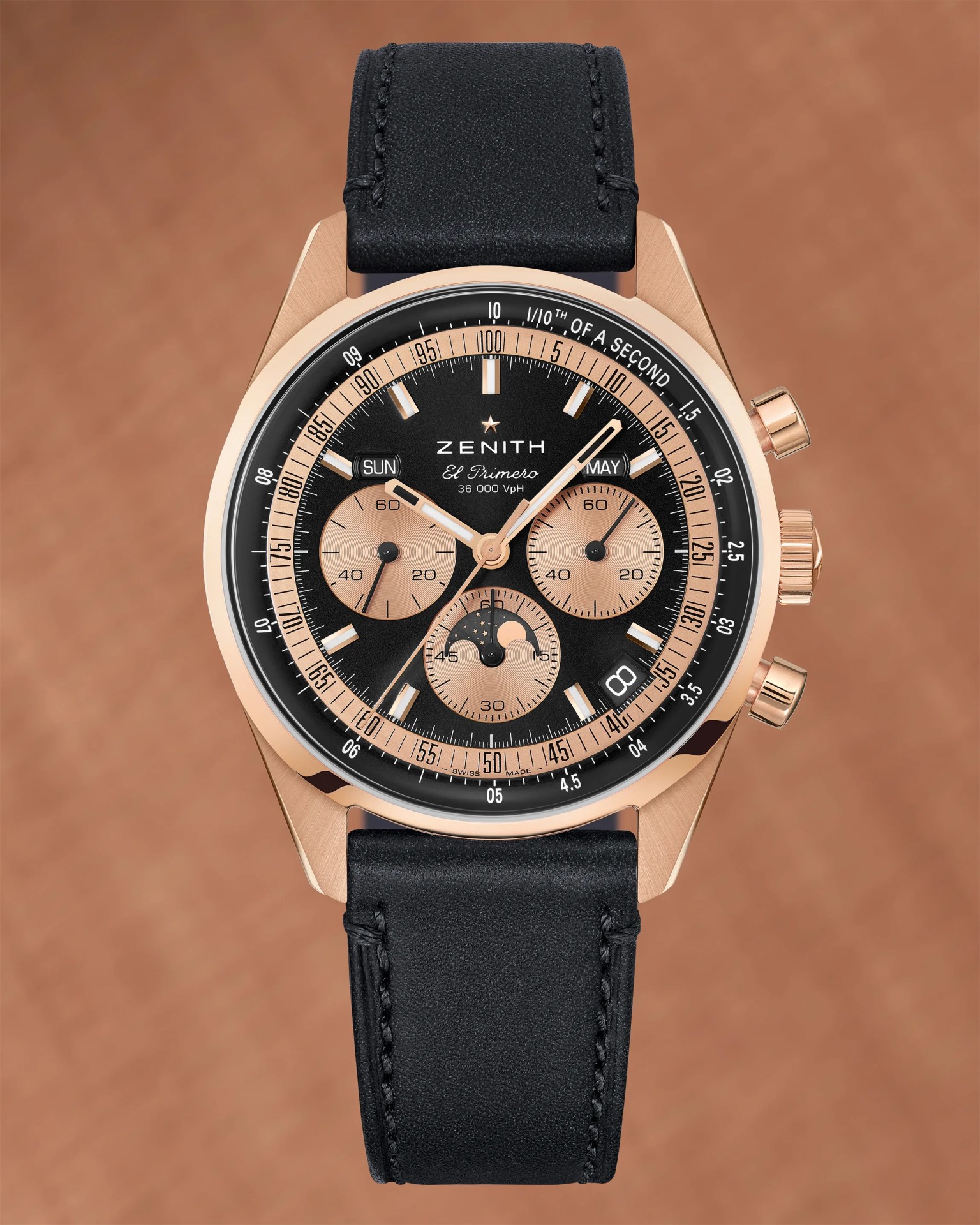 a rose gold Zenith watch with a black leather strap