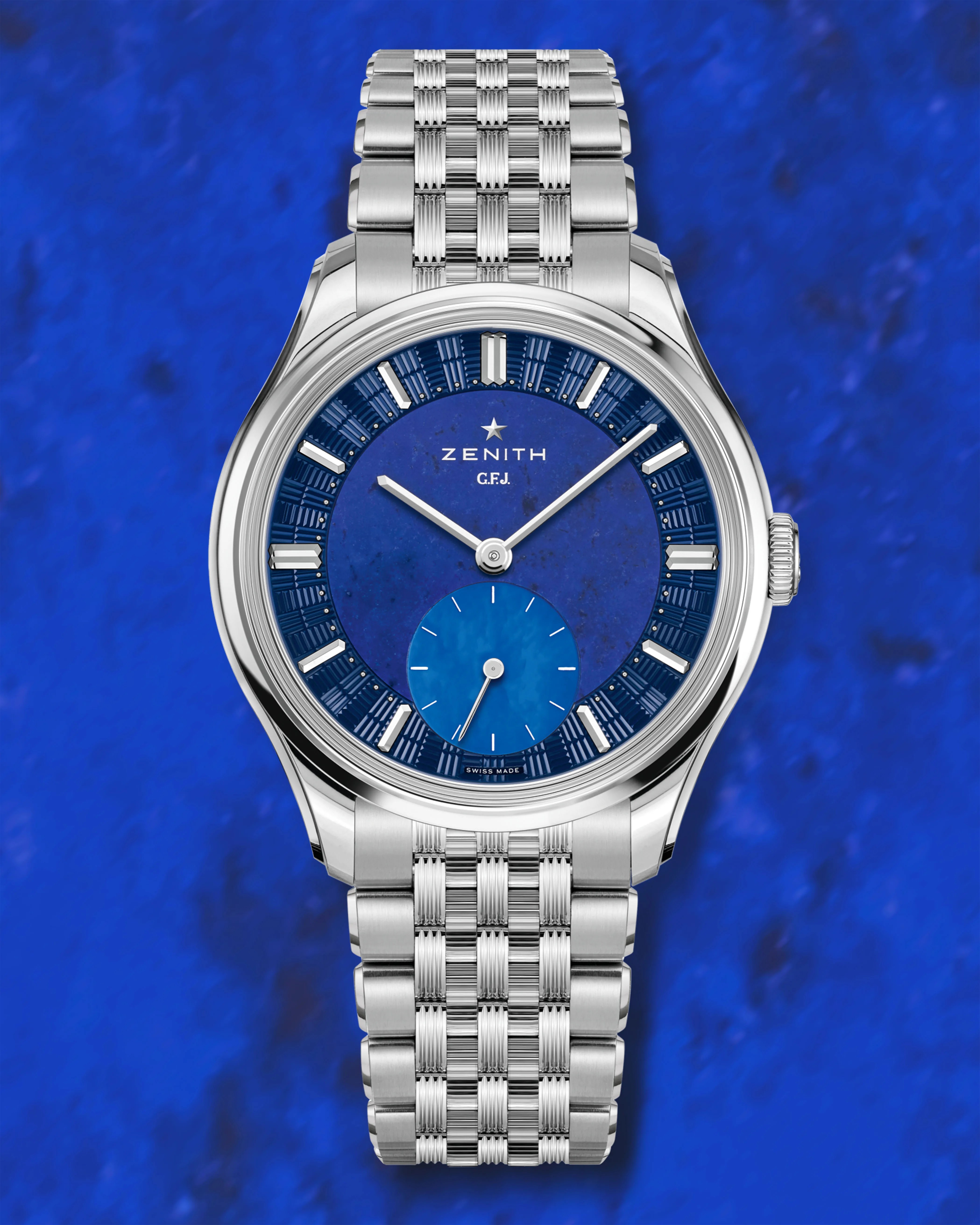 a Zenith watch with a blue dial and steel bracelet