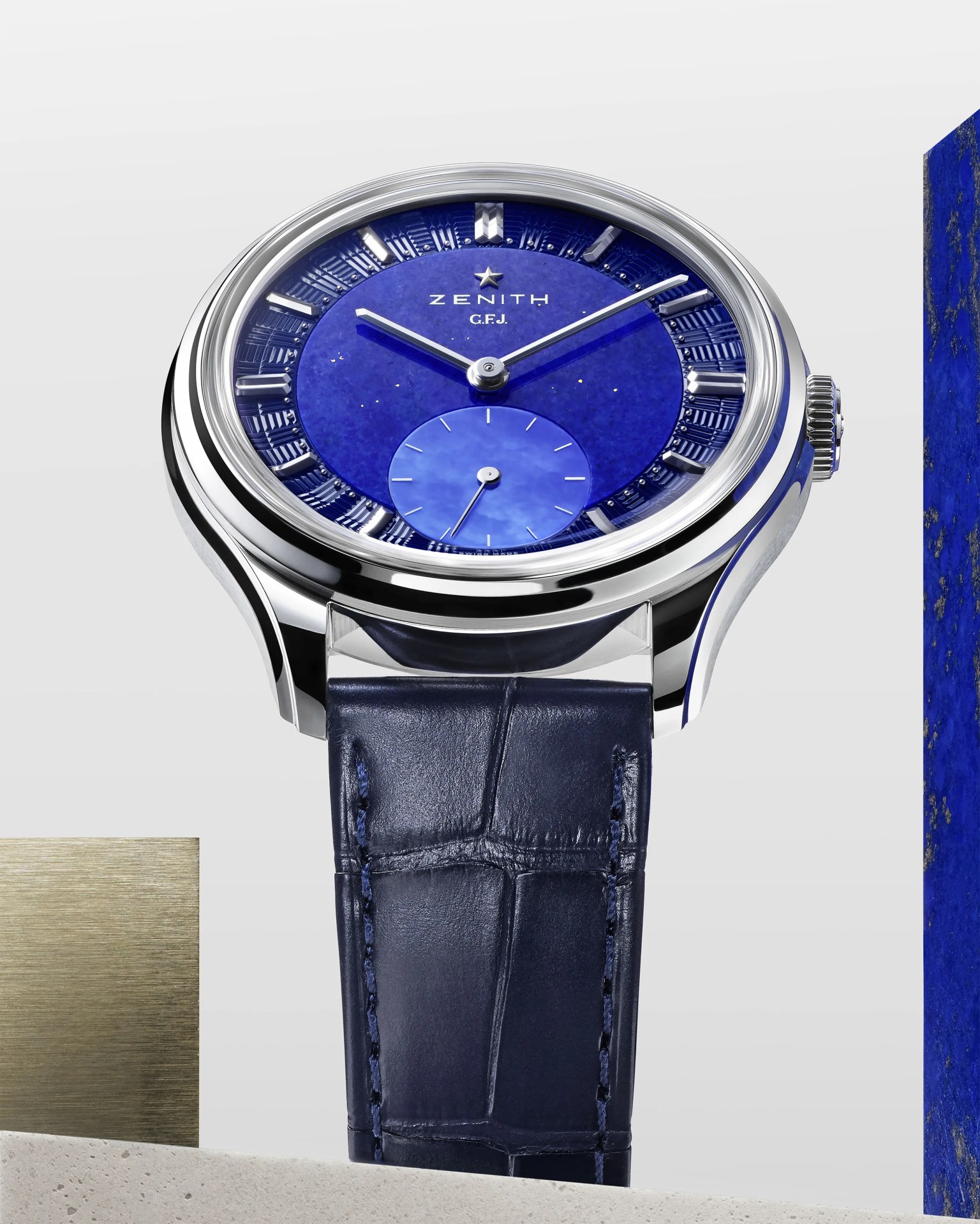 a Zenith watch with a blue dial and blue leather strap