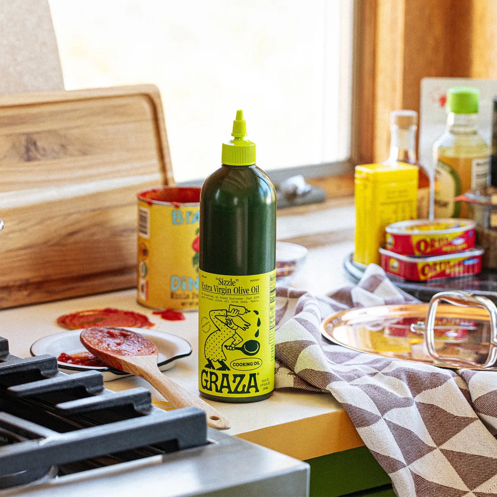 A lifestyle photo of Graza's sizzle olive oil 