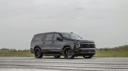 Hennessey Performance H600 Suburban in black shown driving on asphalt pointing to the right