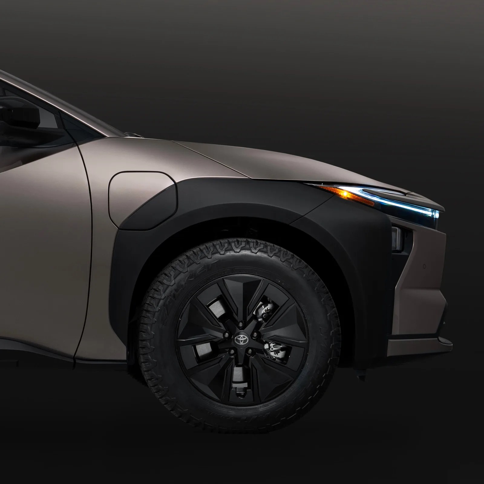 A close-up of the front wheel well of the Toyota bZ Woodland EV