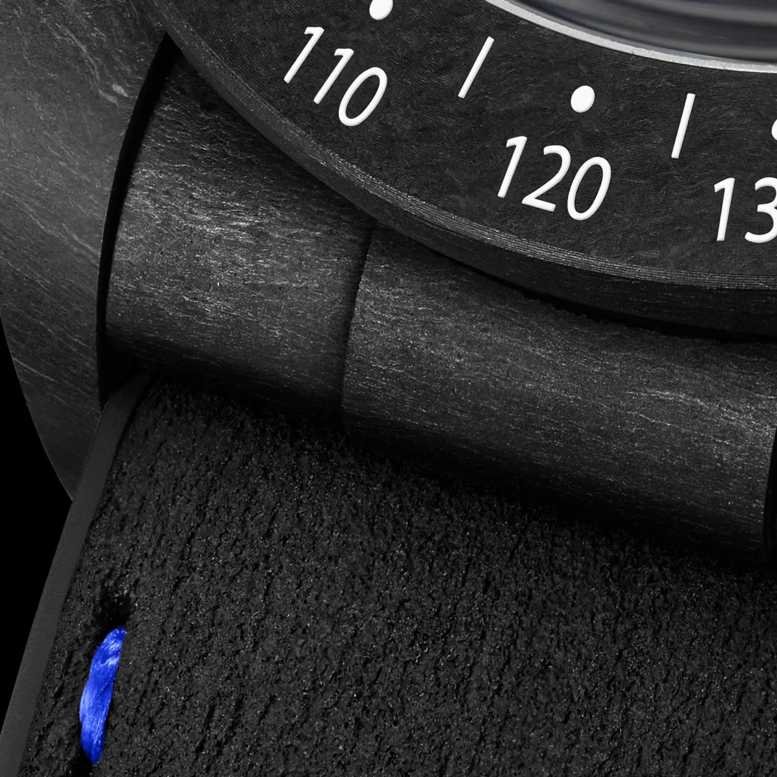 A close up of the case material of the Tudor Black Bay Chrono "Carbon 25" watch.