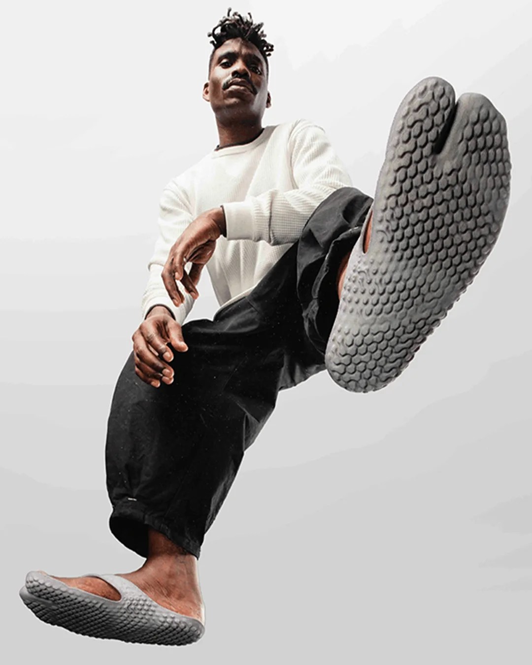 Model wearing Vivobarefoot Tabi Gen 01 3D Printed Flip Flop Sandal