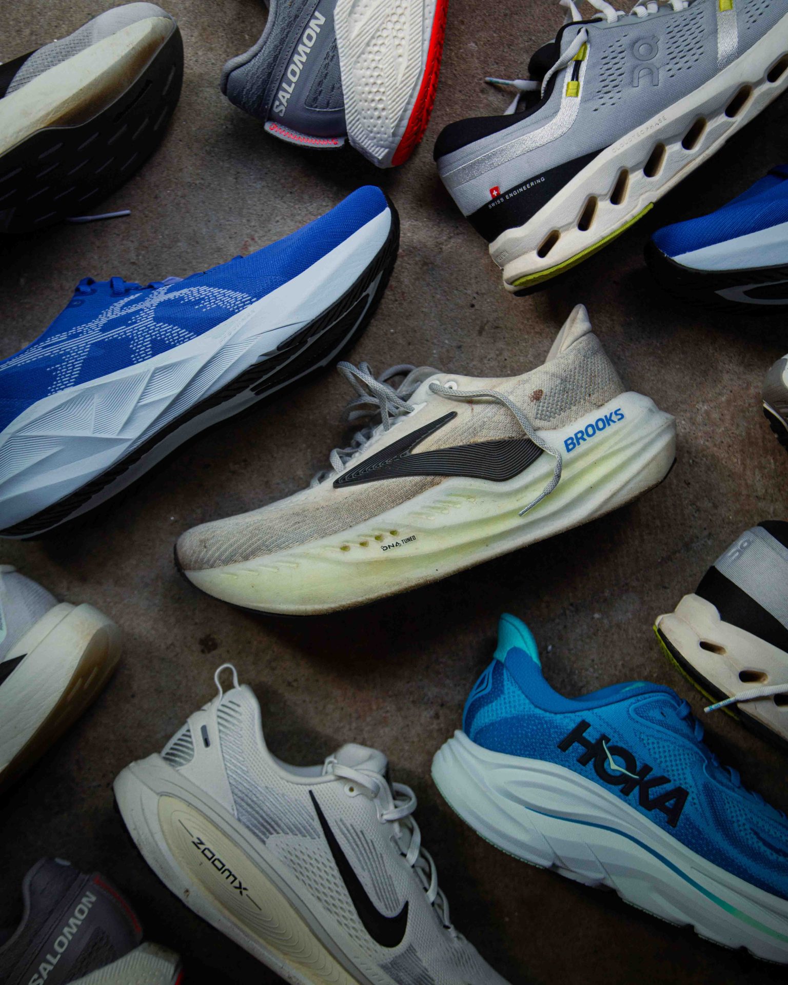 top down photo of different running shoes from brooks, asics, nike, adidas and on