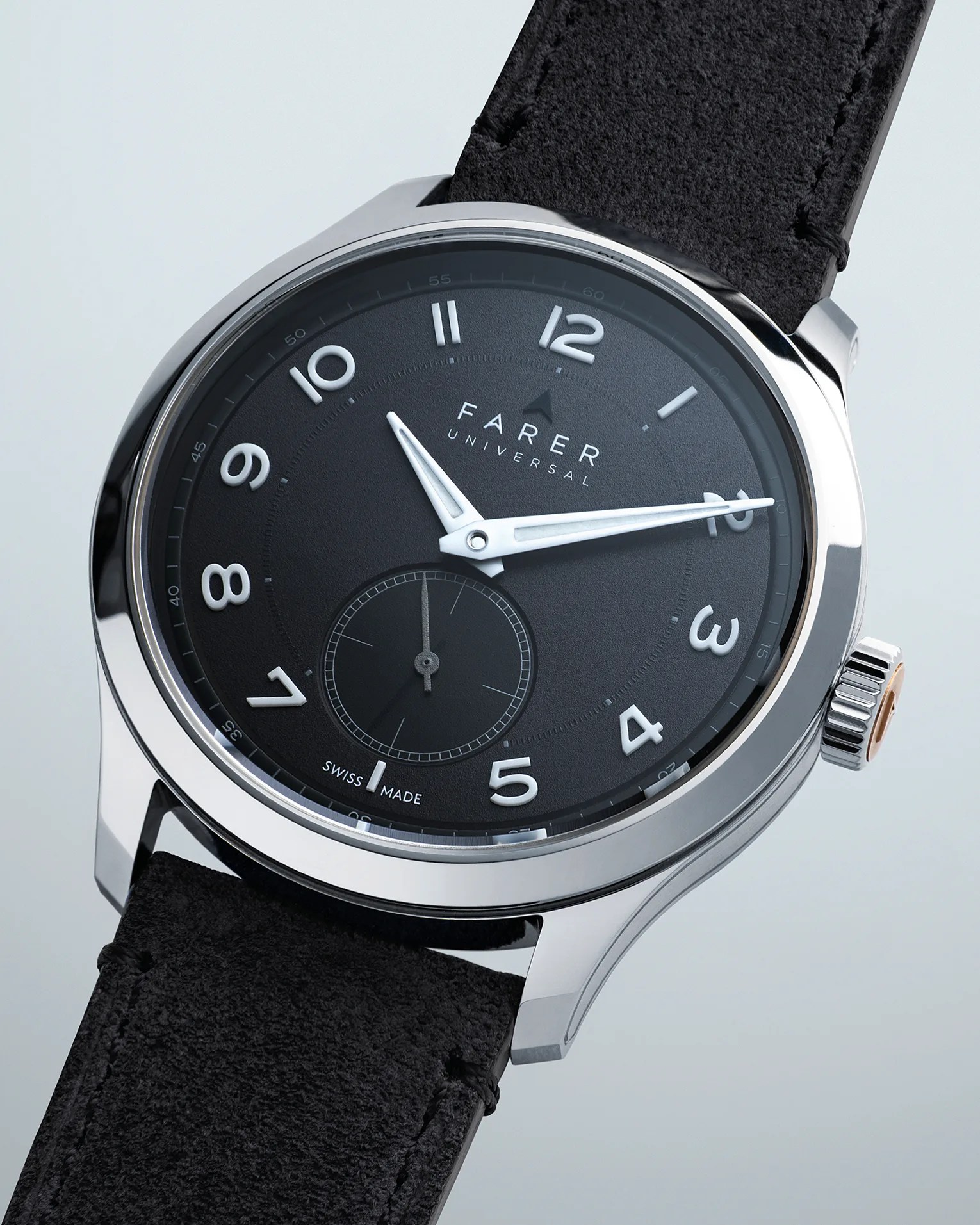 a black dial Farer dress watch with a black suede strap
