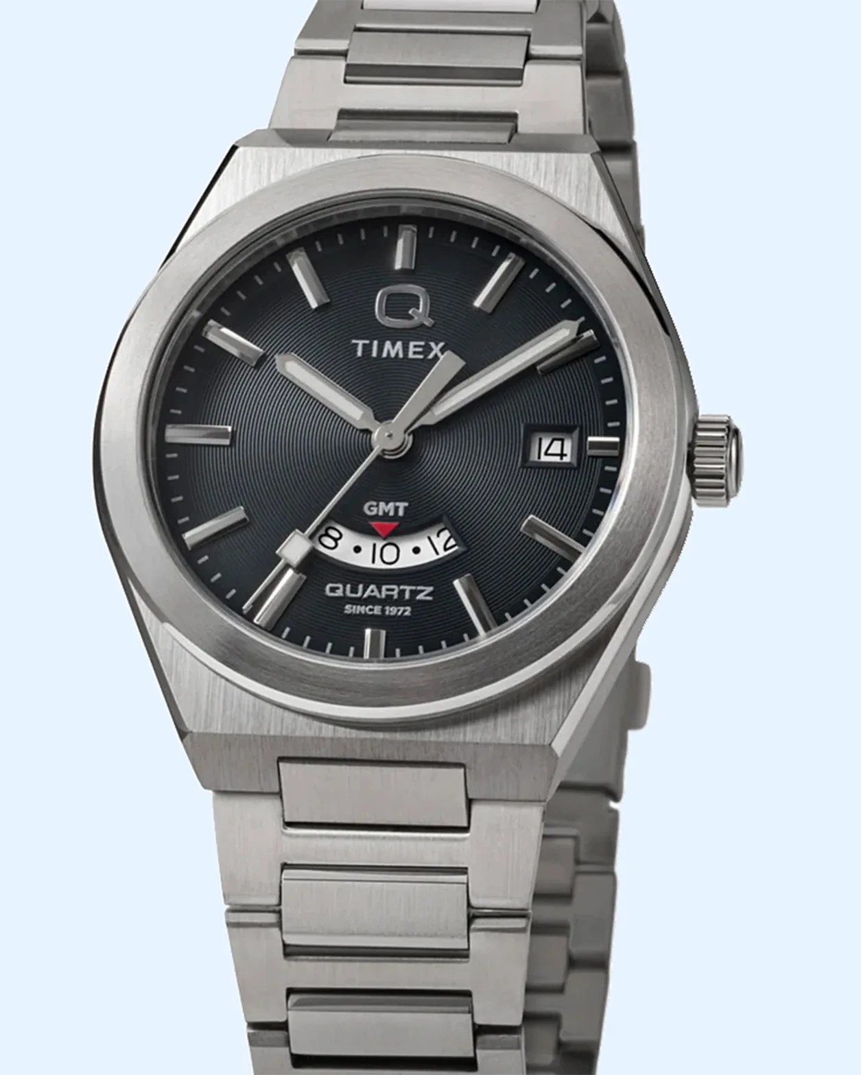 a steel Q timex GMT watch with a blue dial