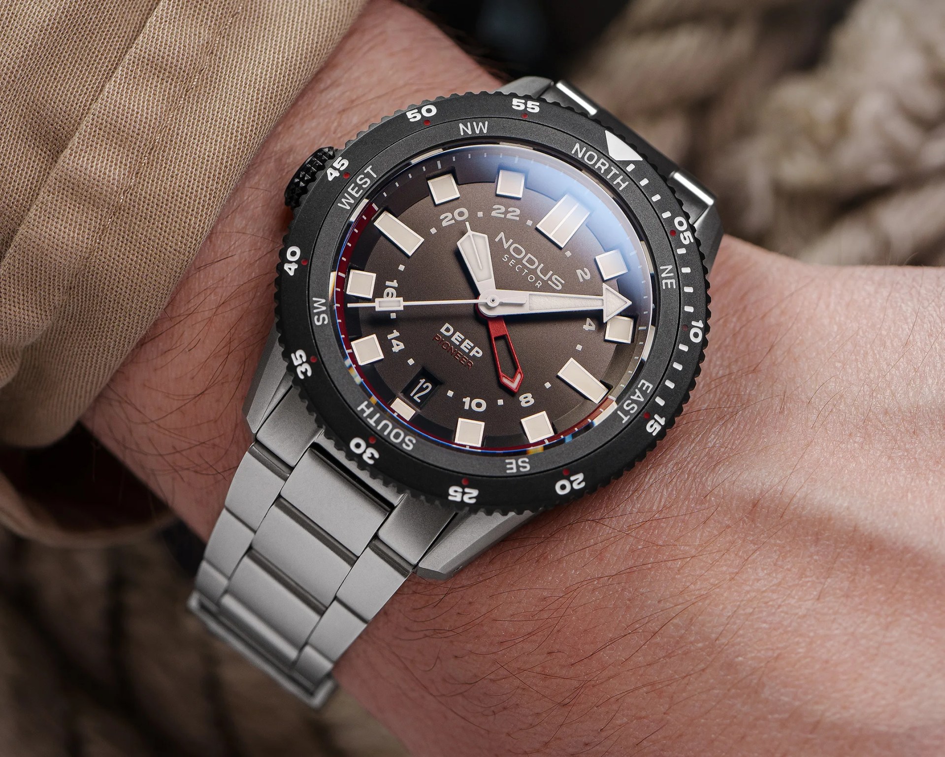 a black Nodus dive watch on a man's wrist