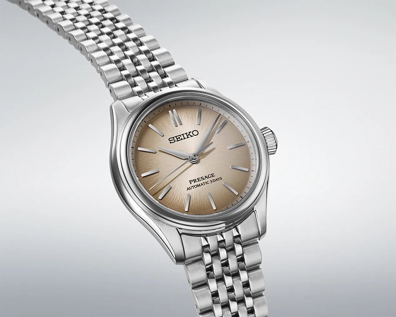 a Seiko dress watch with a cream dial