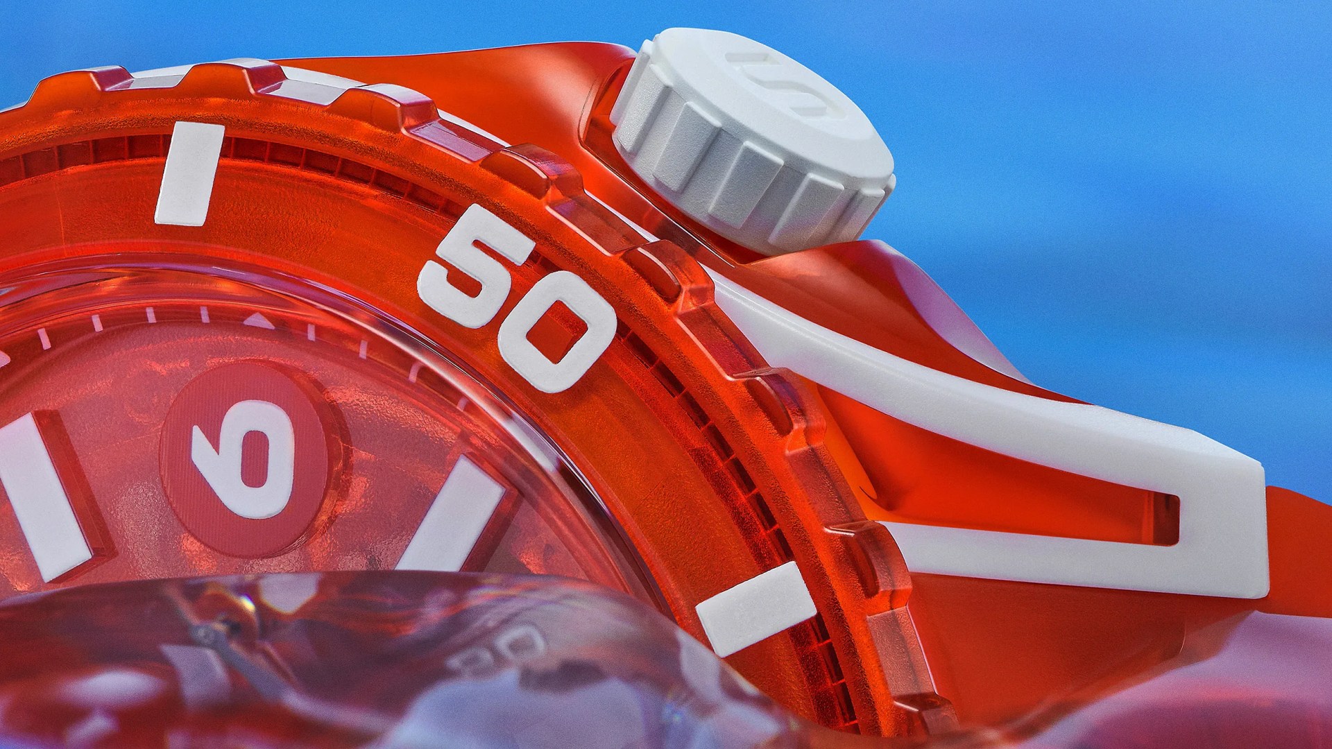 the corner of a red Swatch dive watch