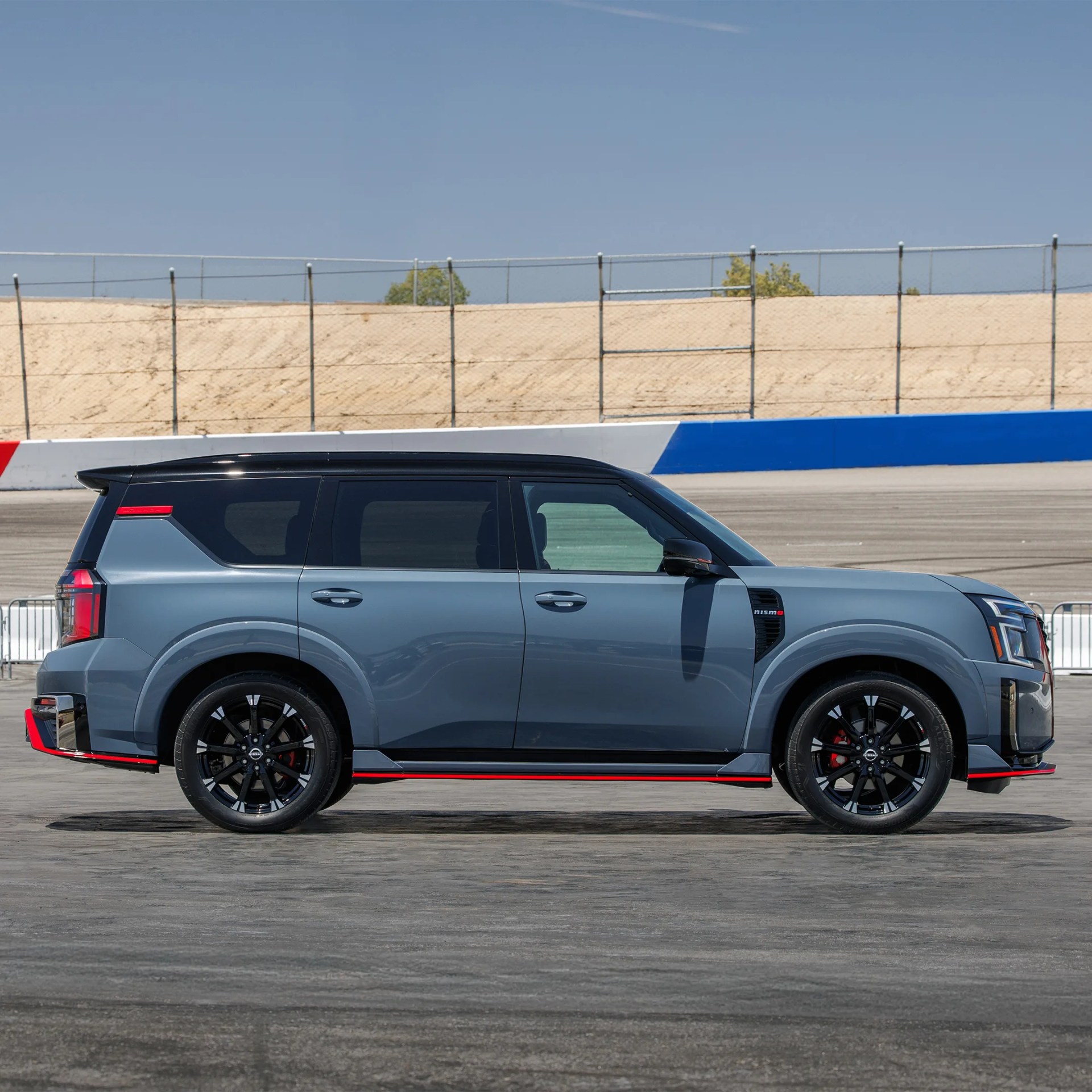 2026 Nissan Armada Nismo SUV profile on racetrack