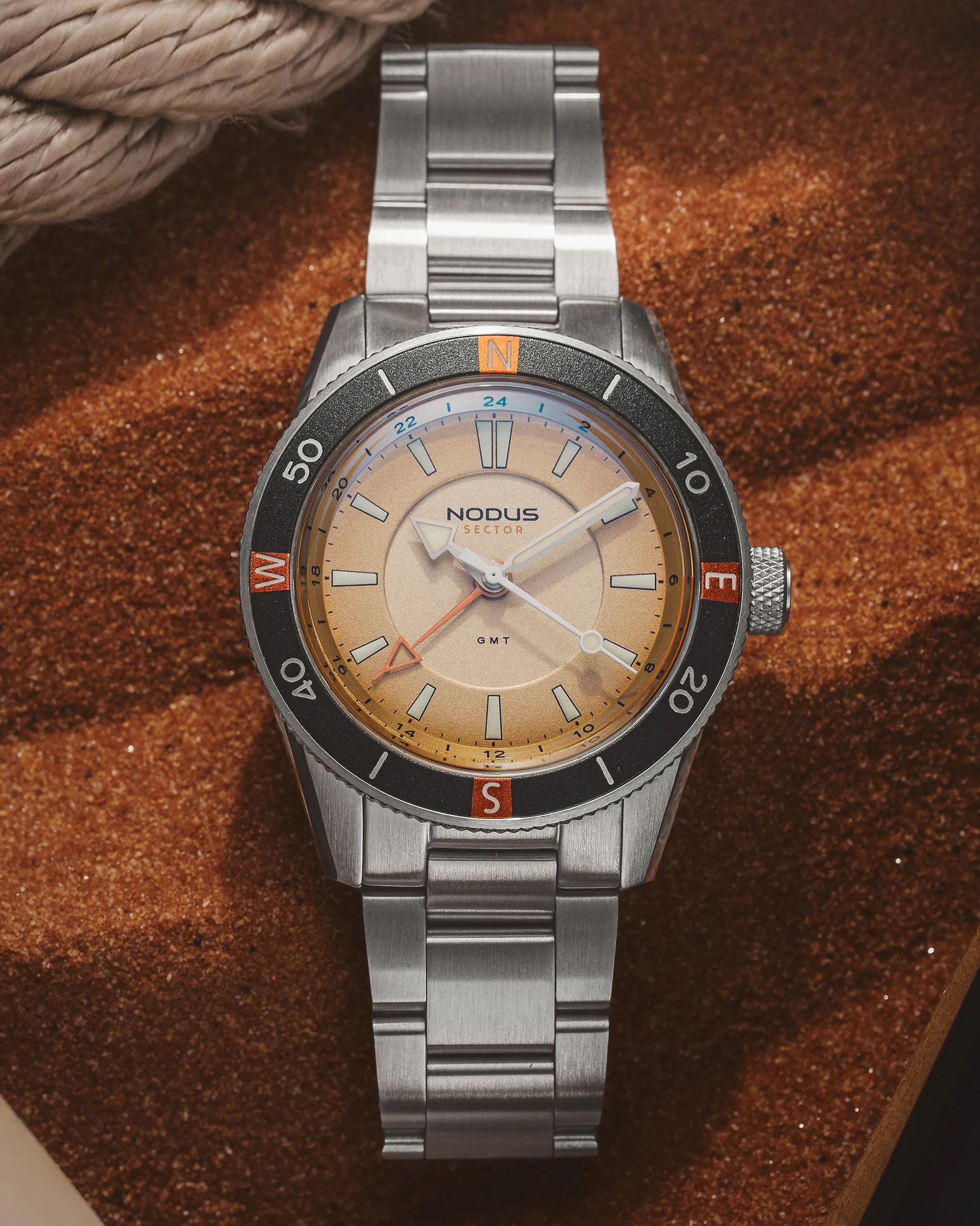 a Nodus GMT watch in sand