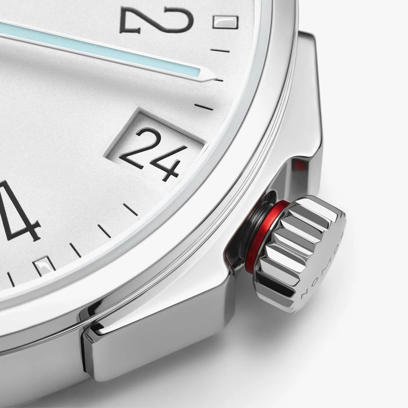 A detailed view of the crown of the Nomos Glashütte Ahoi Neomatik 38 Date in White