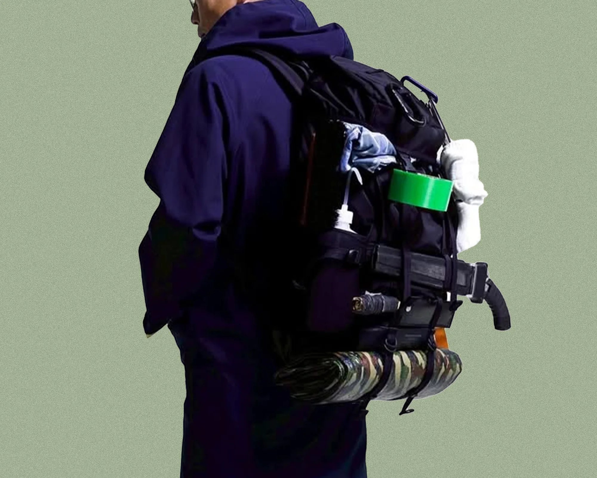 Porter Monochrome EDC Backpack on person's back loaded with stuff