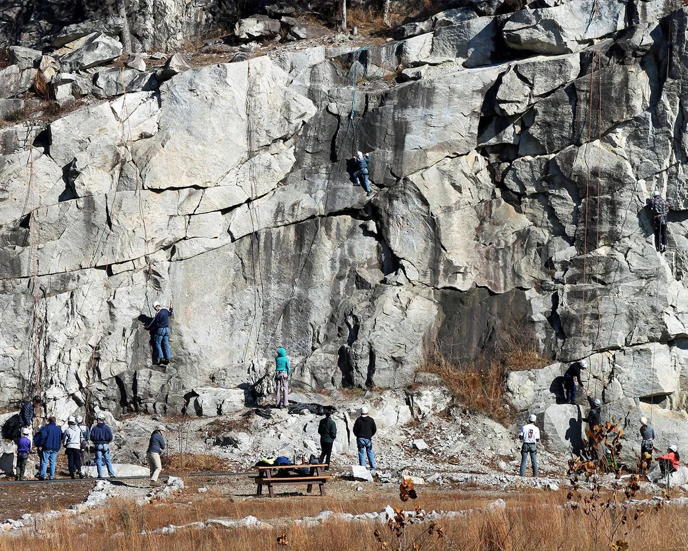 a group of people rock climbing