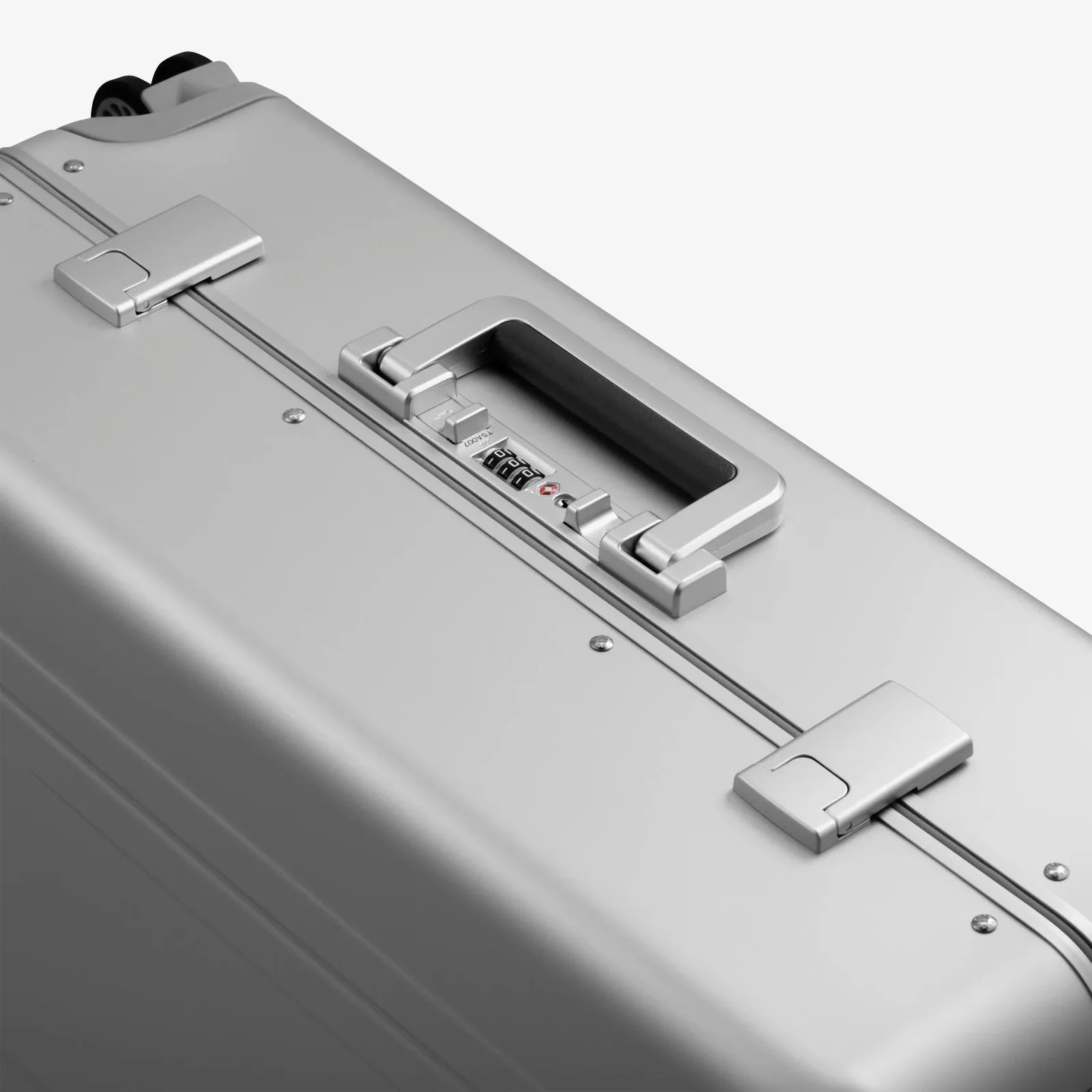 The side lock and handles of the Zero Halliburton Heritage Line Medium Travel case