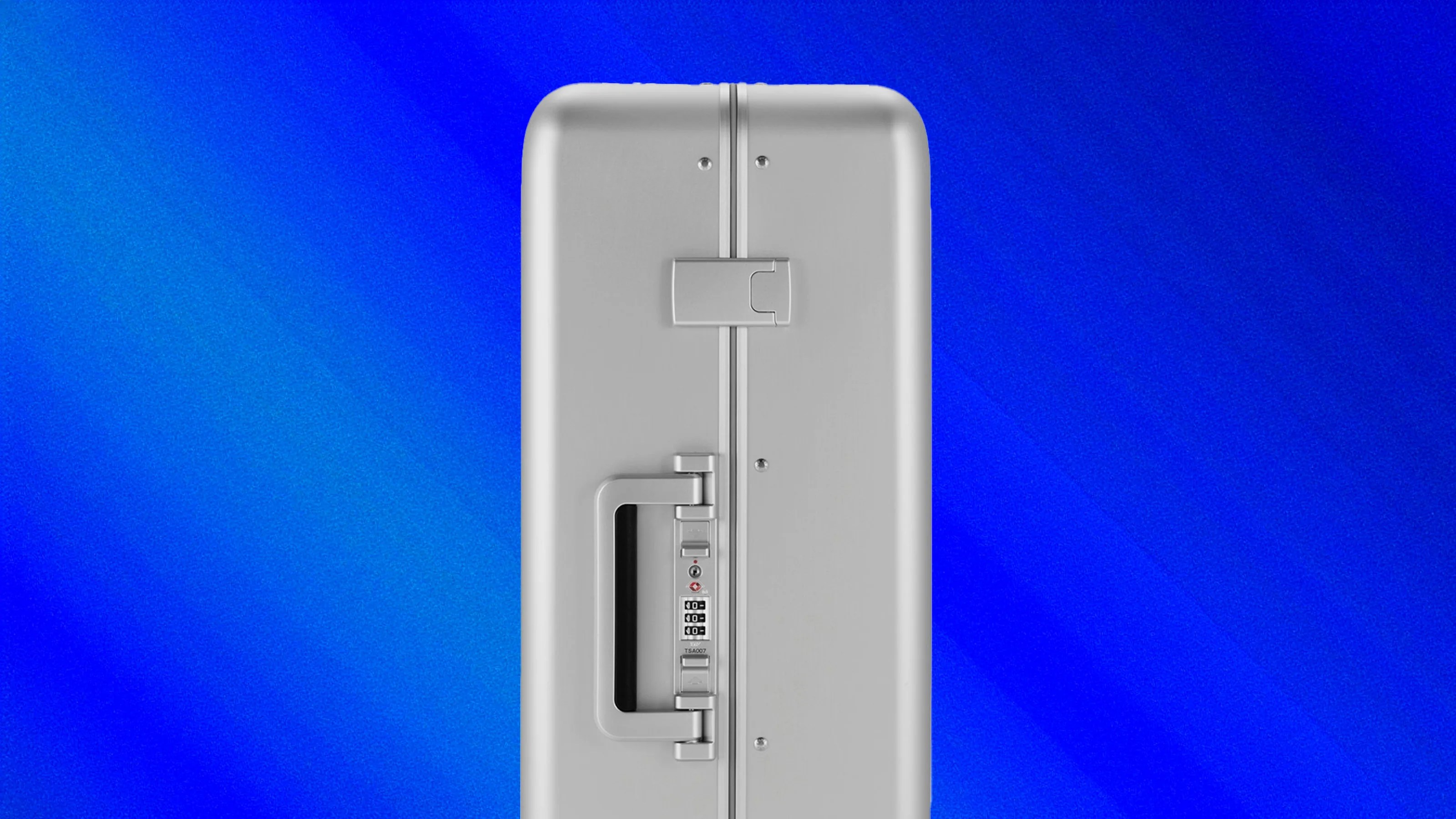 A side view of the Zero Halliburton Heritage Line Medium Travel case against a blue gradient background.