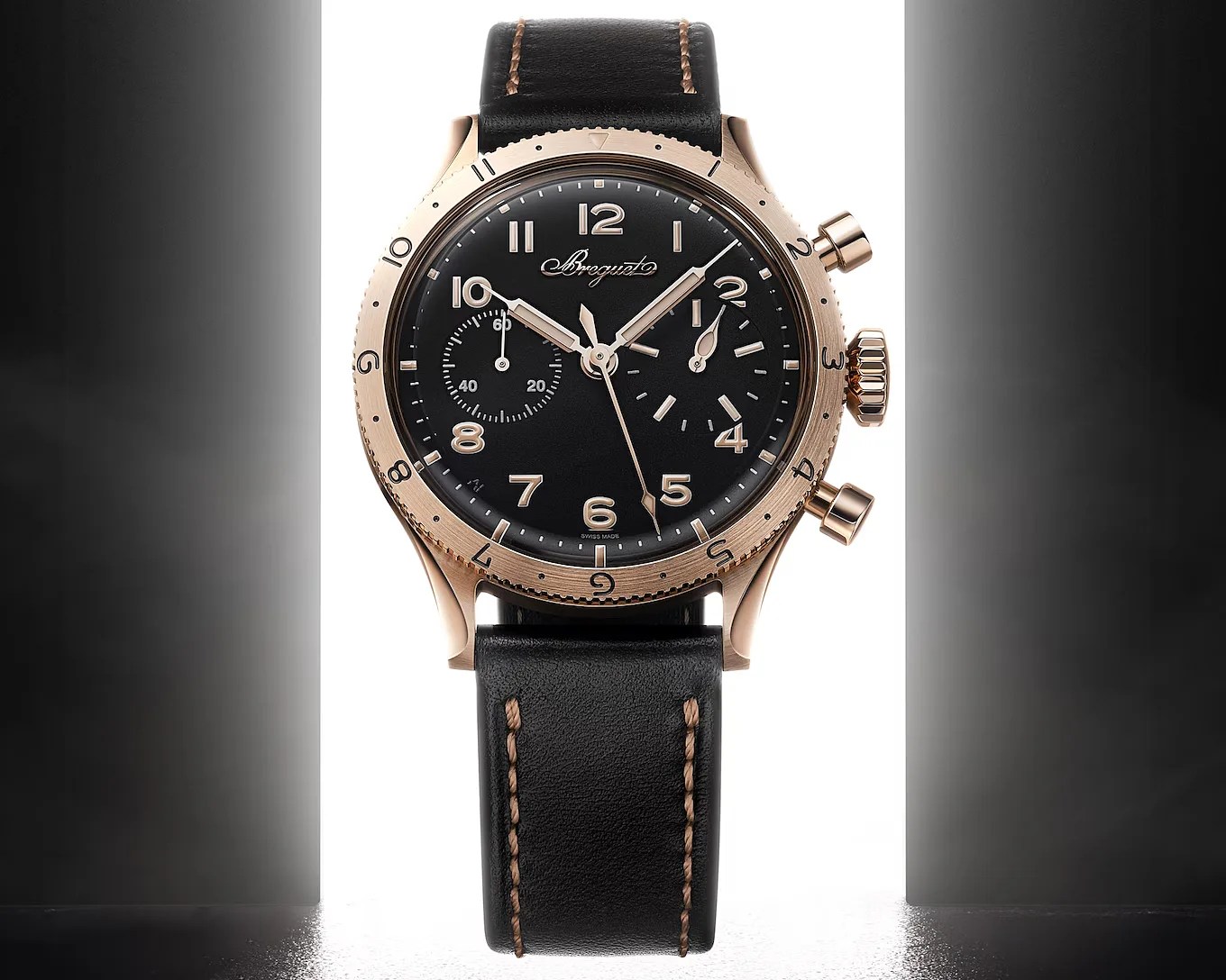 a gold Breguet watch with a black dial