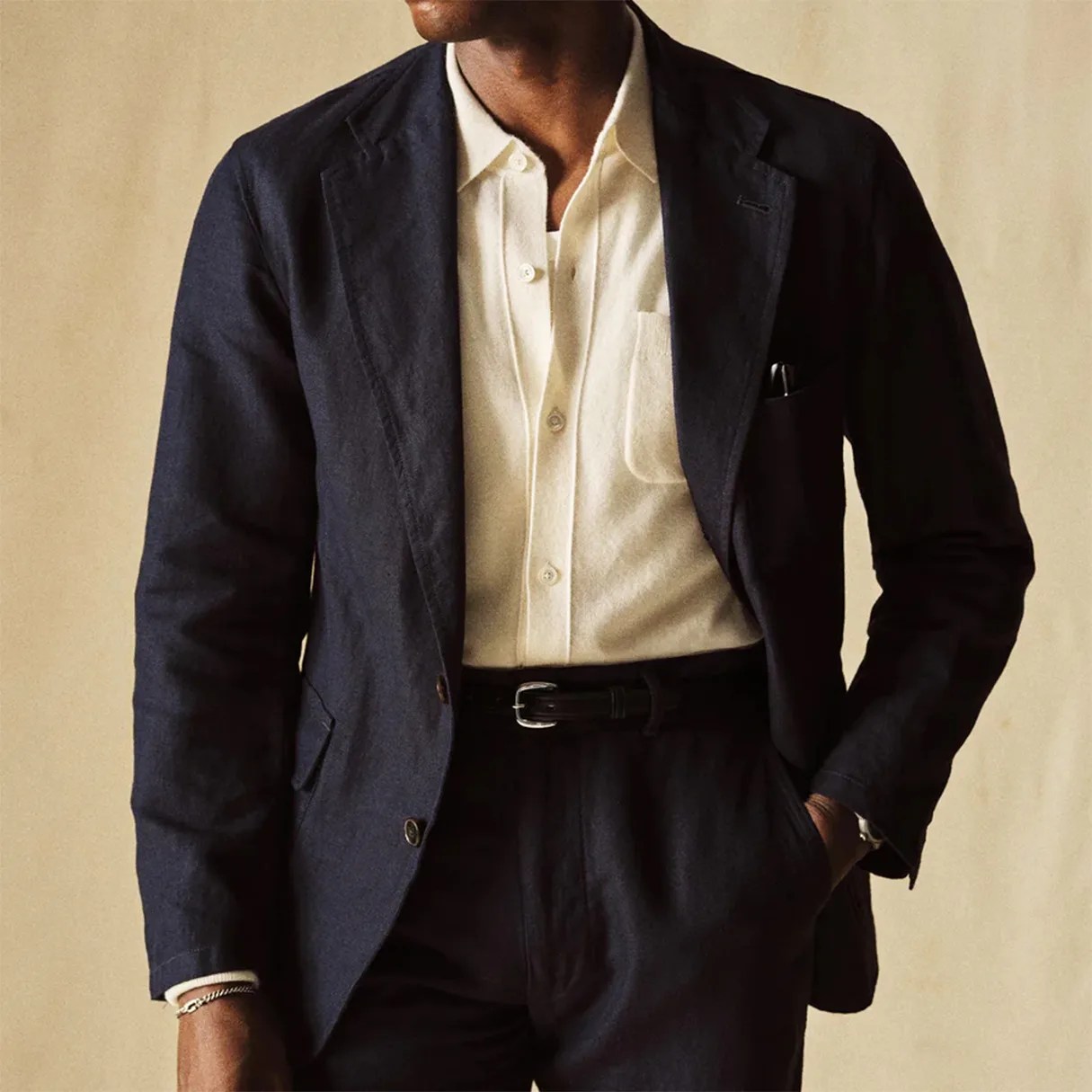a man in a navy blue blazer