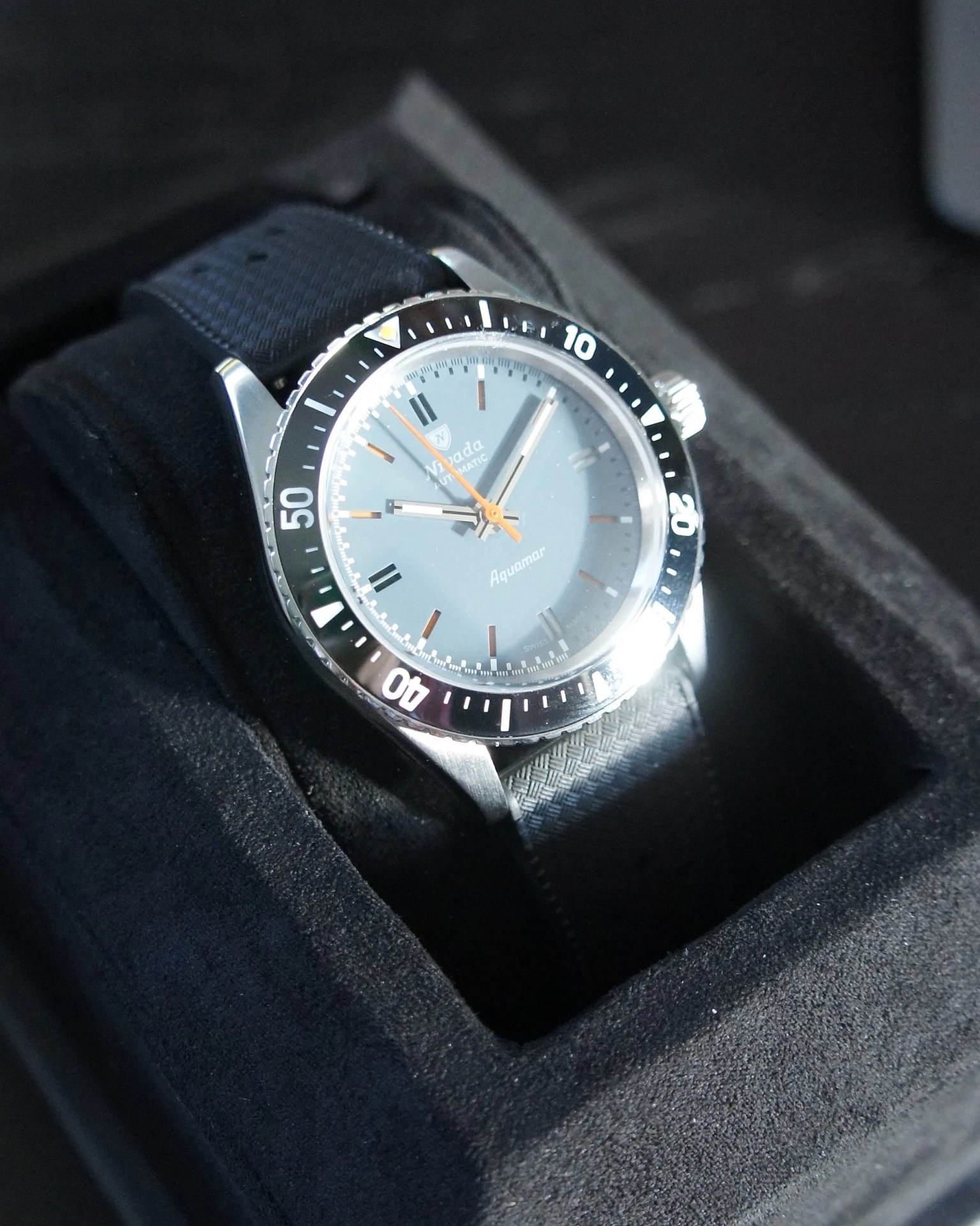 a dive watch in its box