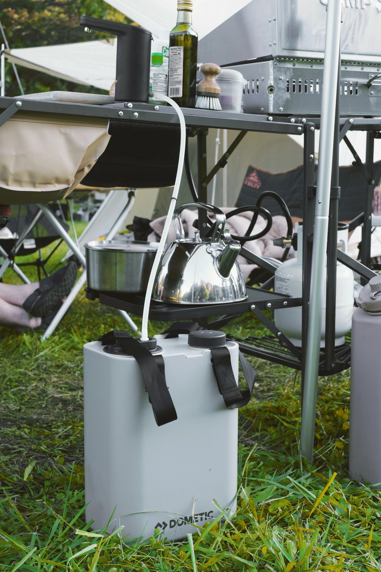 the Dometic Go Hydration Water Faucet shown integrated into a camp kitchen setup