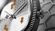the dial of a watch painted with honey combs