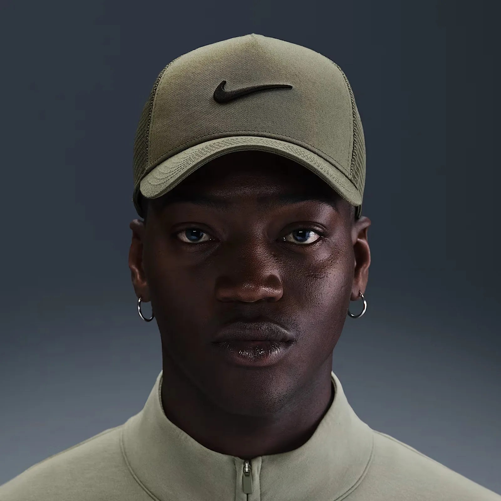 NIke Rise Trucker hat in green on a male model