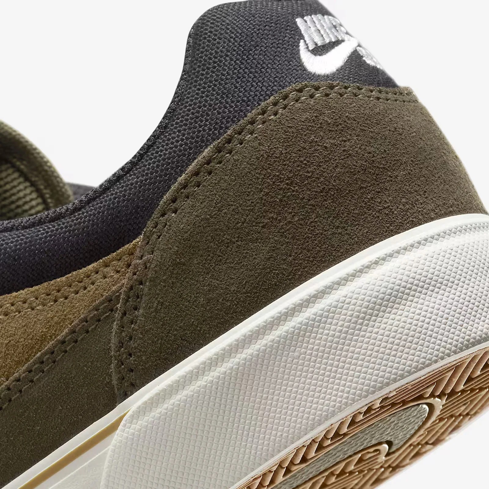 A close-up of the hell of the Nike SB Malor in Medium Olive Cargo