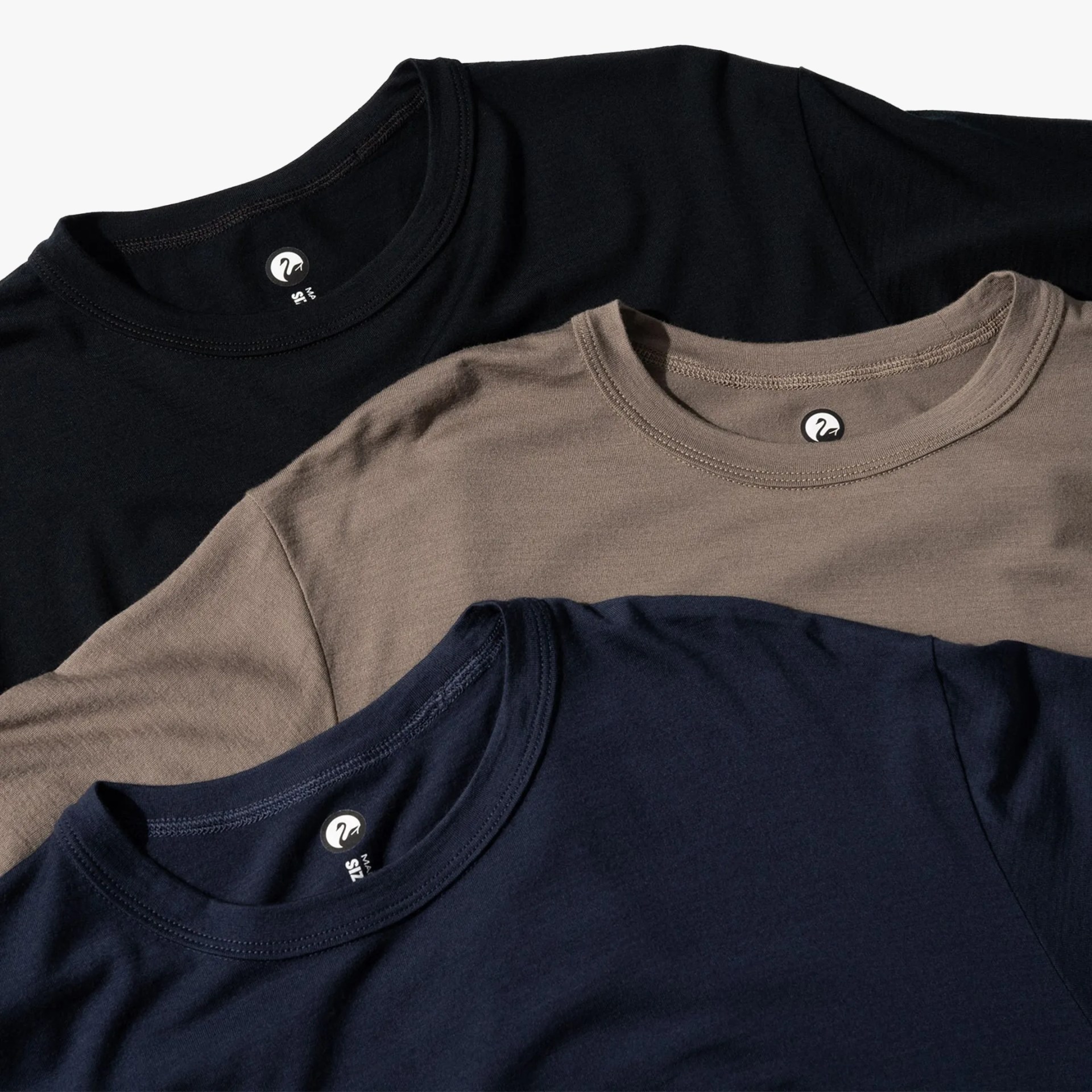 Outlier Merino Cut Two T-Shirt trio flat-lay