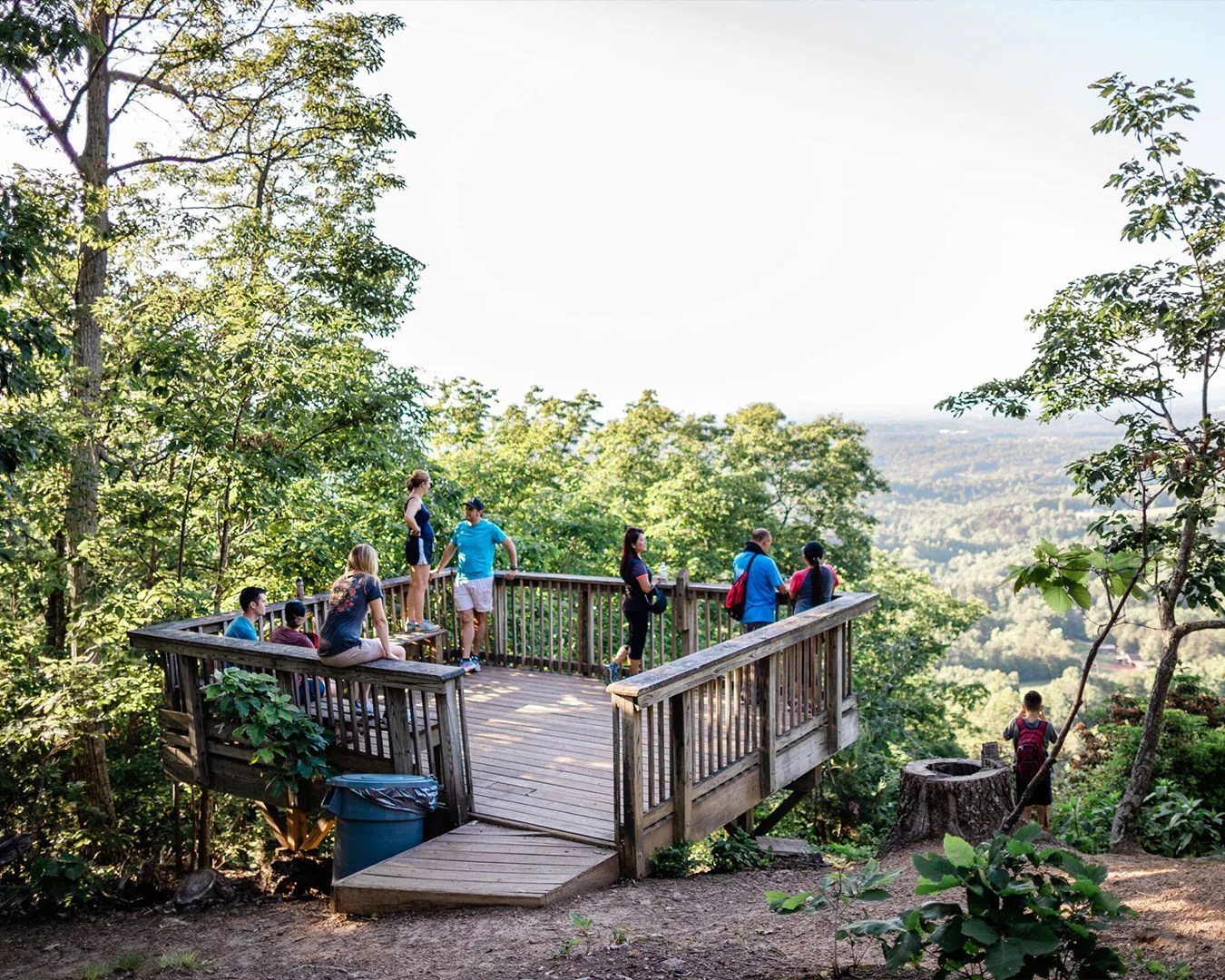 a group of people standing on a deck at bakers mountain park