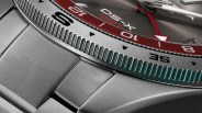 a closeup of the bezel on a certina gmt watch