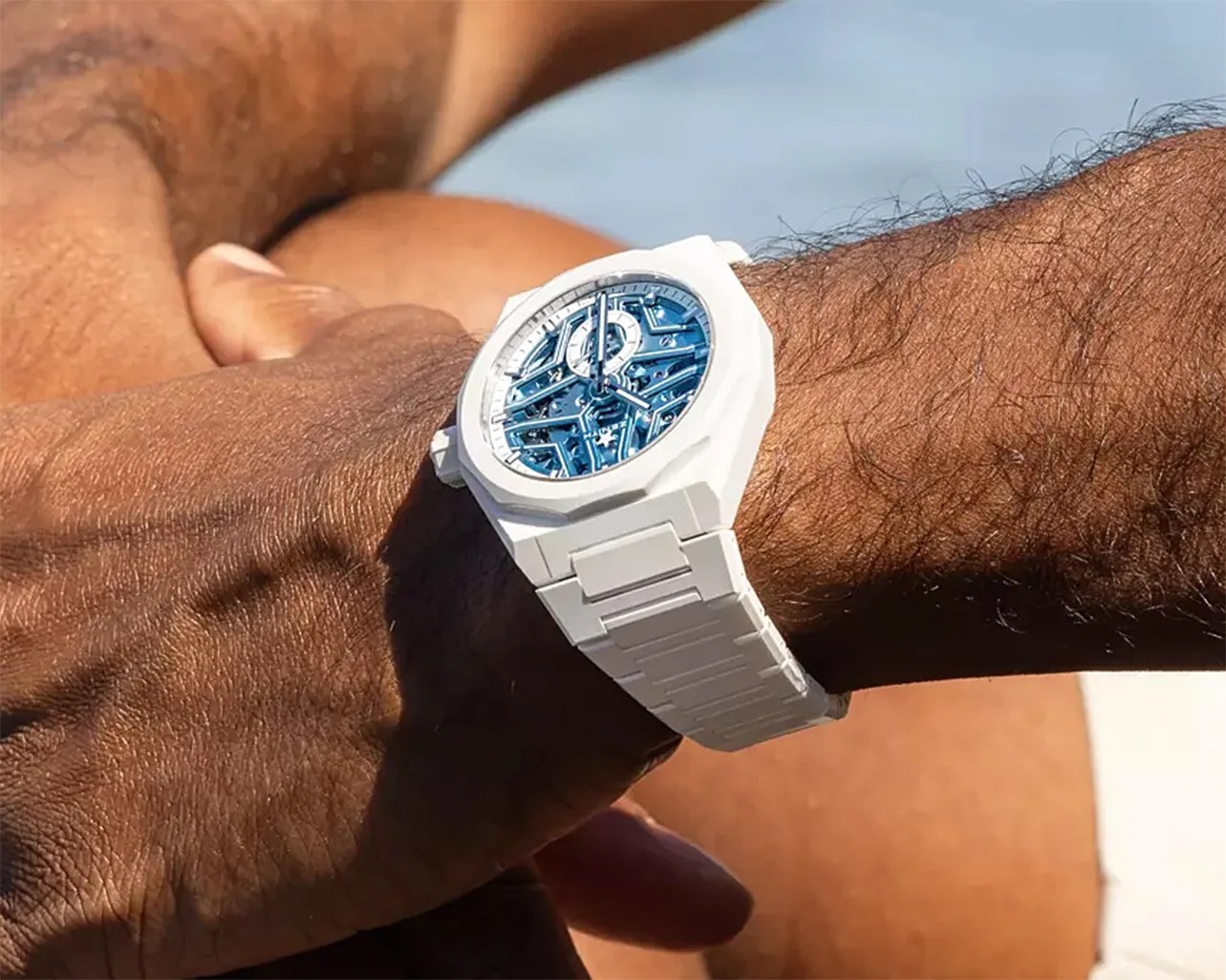 a white Zenith watch on a man's wrist
