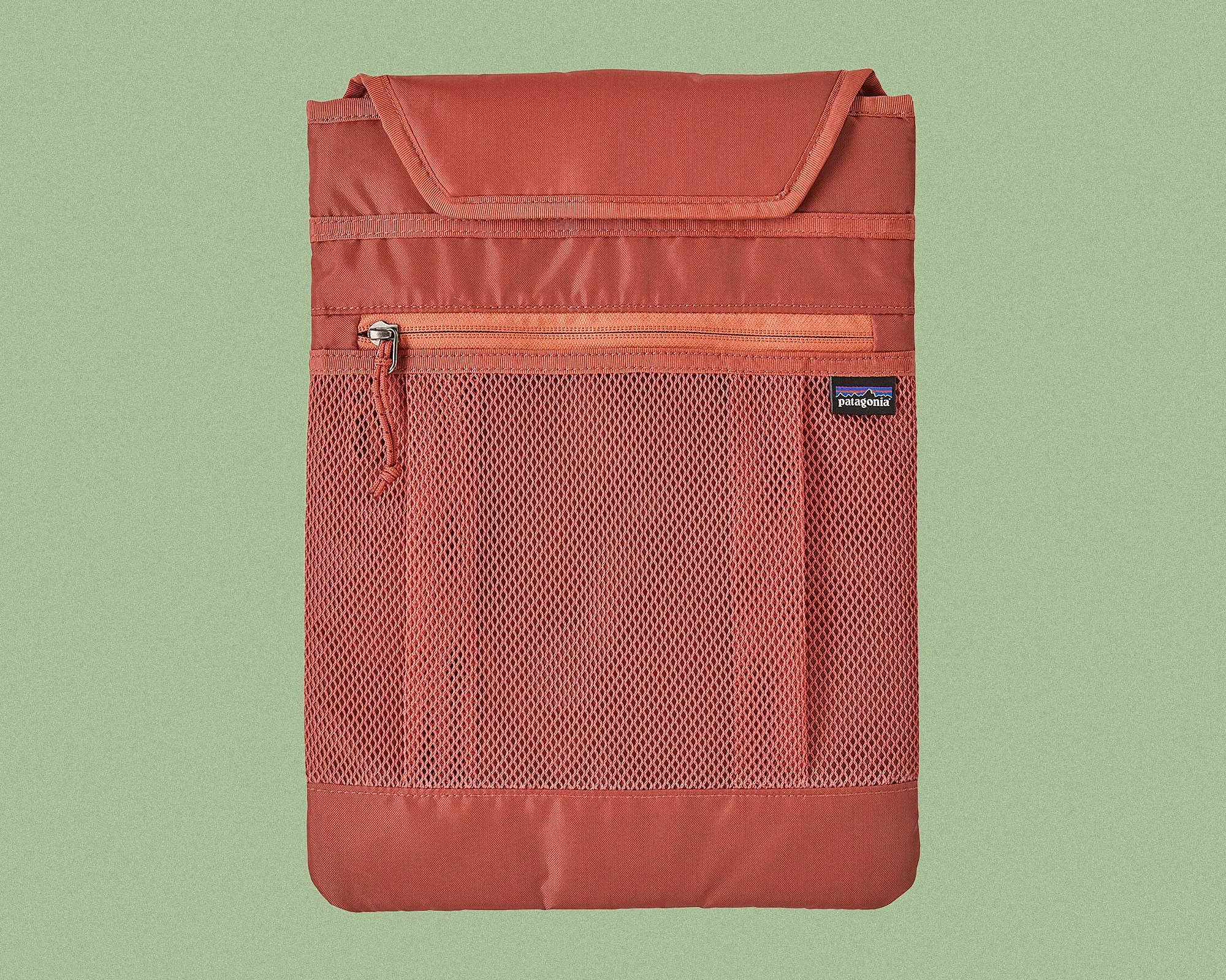 Rust-colored Patagonia pouch with a mesh front pocket and a zippered compartment above it, featuring a flap closure at the top.
