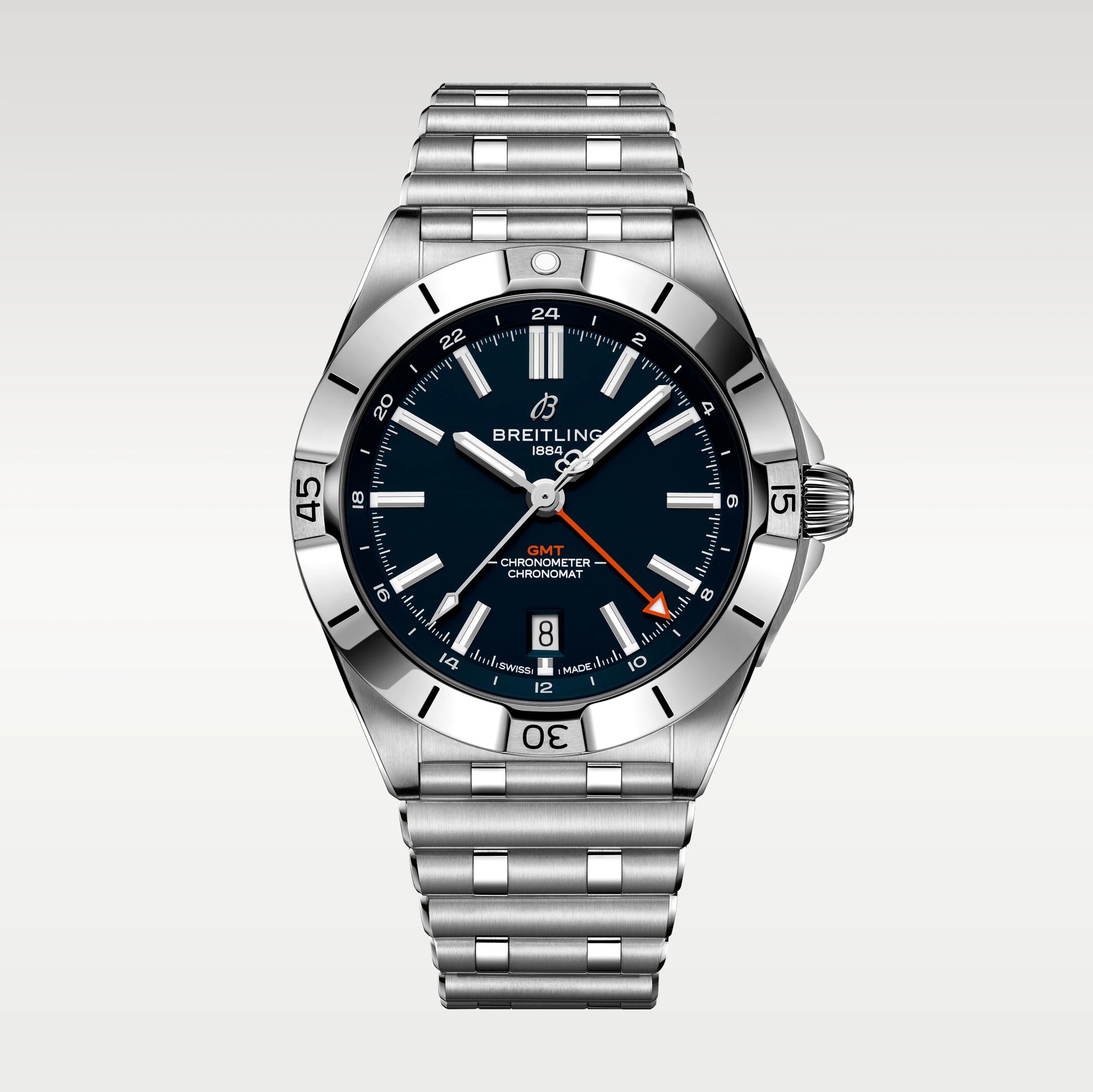 Stainless steel Breitling Chronomat GMT watch with a black dial, silver hour markers, and hands. It features a date window at 6 o'clock, an orange GMT hand, and a rotating bezel with engraved minute markers. The watch has a stainless steel bracelet with polished and brushed links.