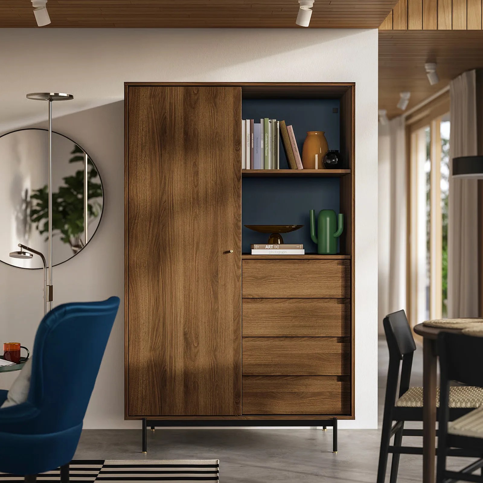 The IKEA RADMANSO wardrobe shown head on with books on its top shelf. A circular mirror is shown mounted on the wall to the left of the wardrobe.