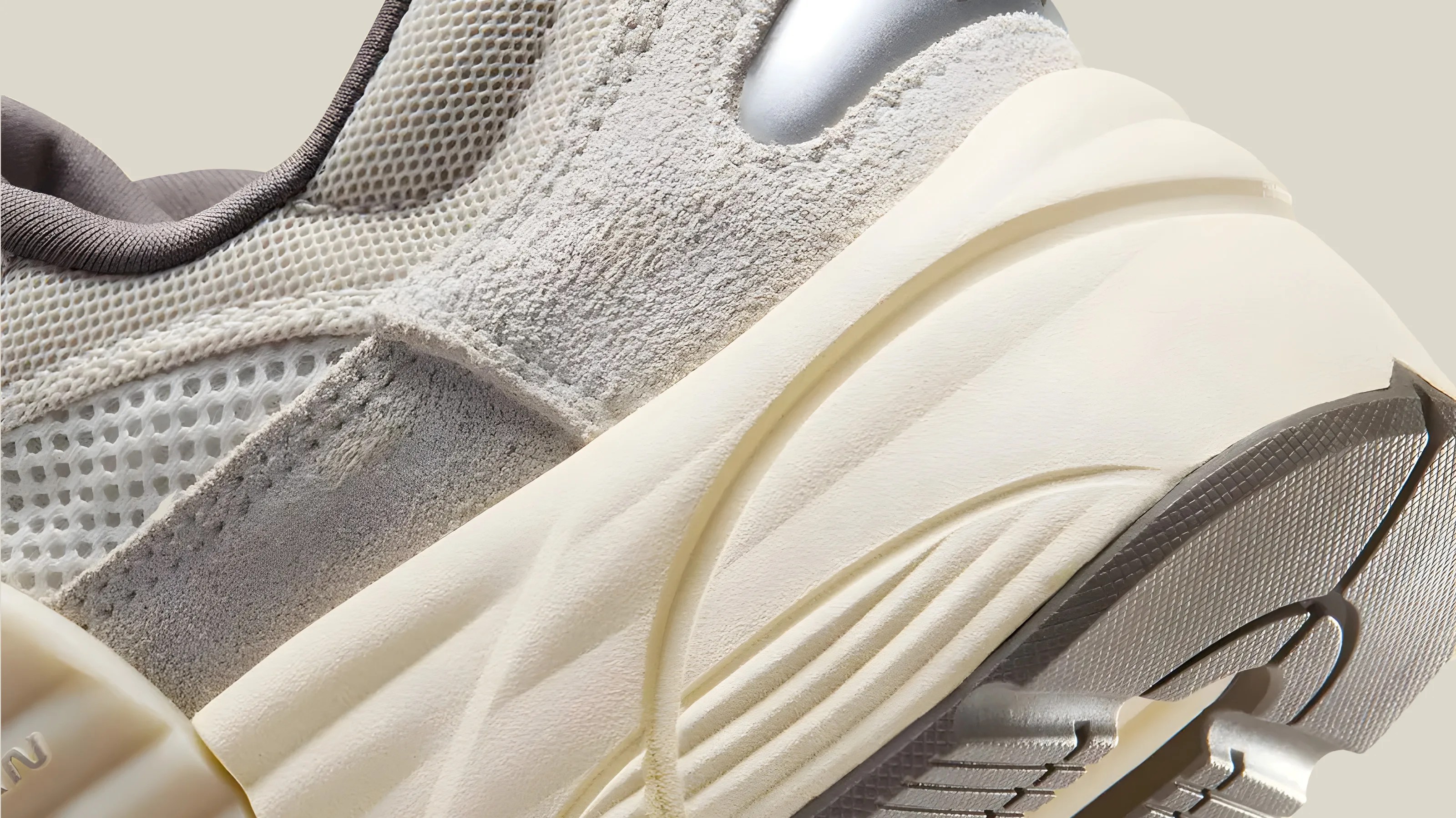A close-up of the heel detail on the Jordan Trunner O/S in "Phantom", which is a colorway that mixes light greys, tans and light yellows