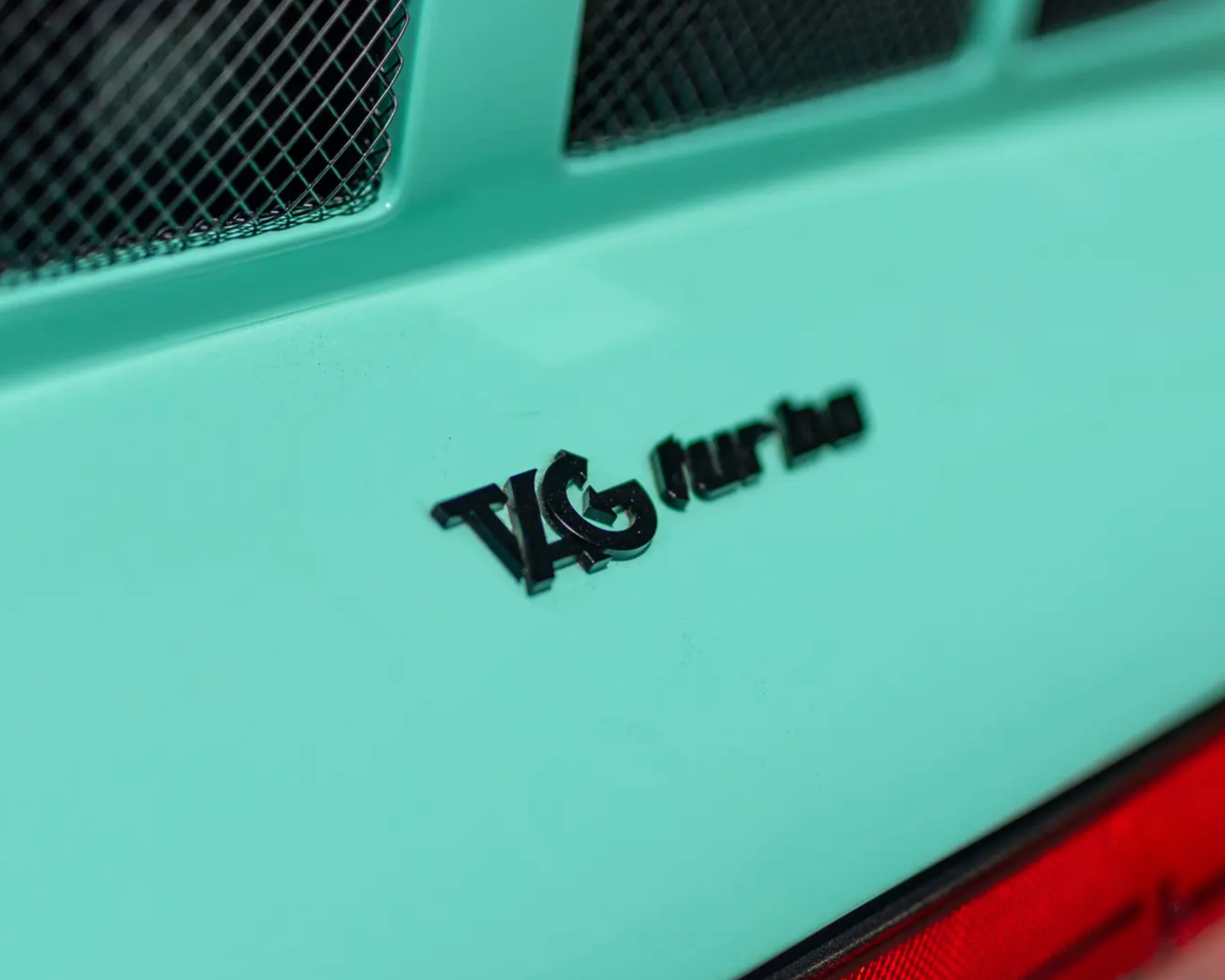 a photo showing a close-up of a custom porsche 911 badge