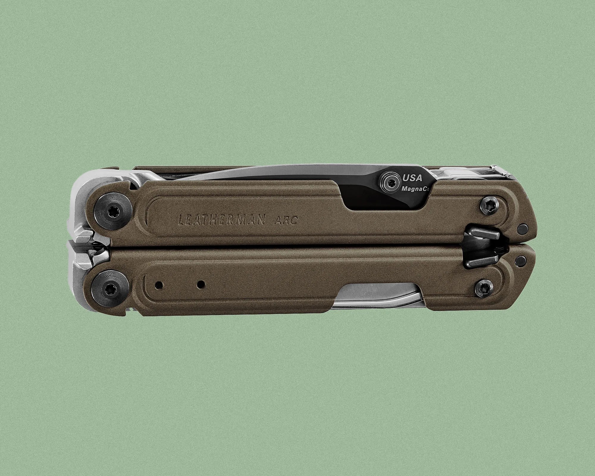 Folded Leatherman ARC multi-tool with a brown handle and visible blade marked "USA MagnaCut," set against a plain green background.