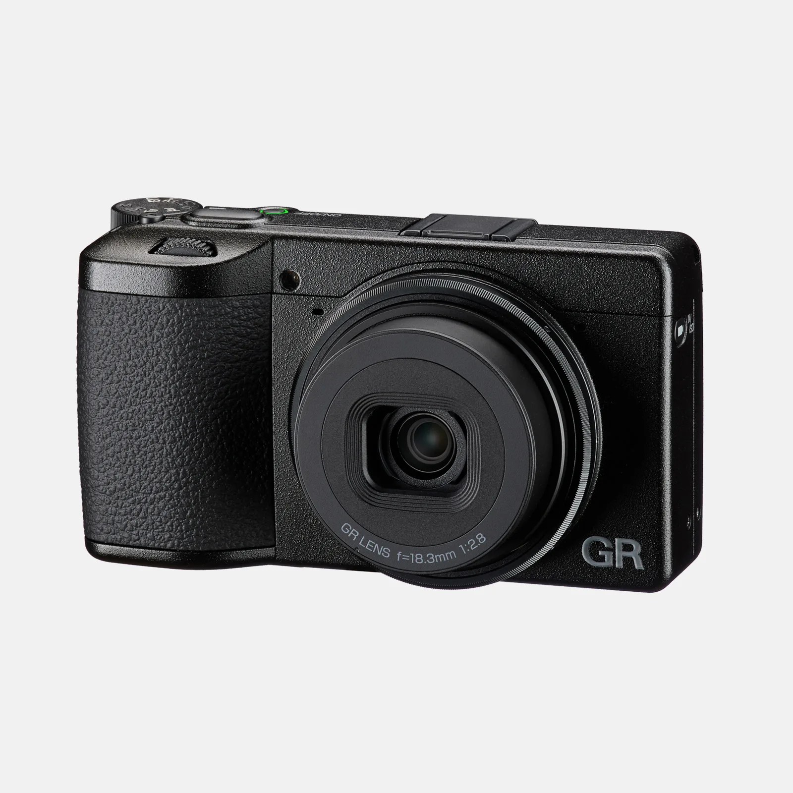 Compact black digital camera with a textured grip on the left side, a prominent lens in the center labeled "GR LENS f=18.3mm 1:2.8," and the letters "GR" on the bottom right corner of the front panel.