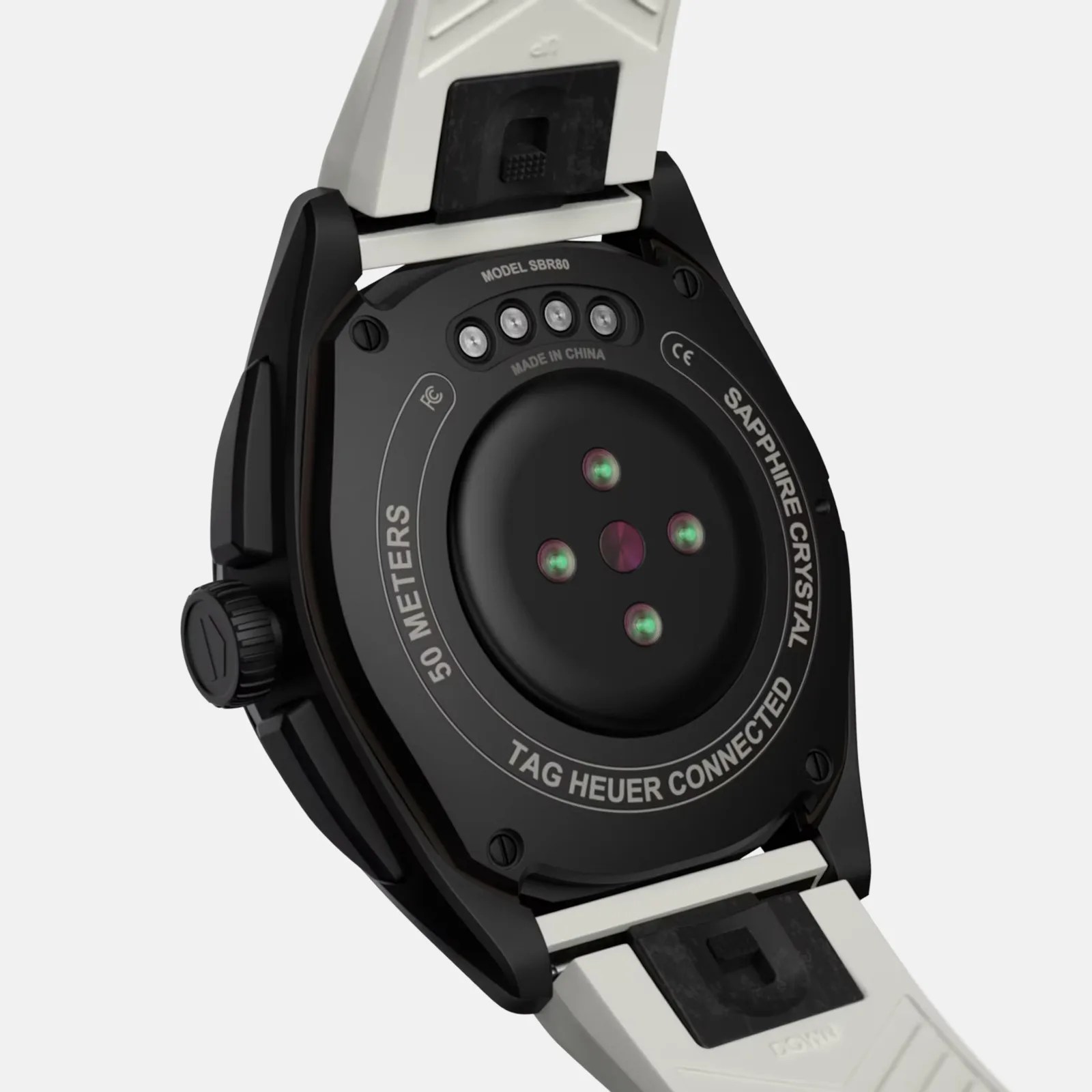 Back of a TAG Heuer Connected smartwatch with a black case, white strap, and multiple sensors in the center. Text around the sensors reads "50 METERS," "TAG HEUER CONNECTED," and "SAPPHIRE CRYSTAL." The model number "SBR80" and "MADE IN CHINA" are also visible.