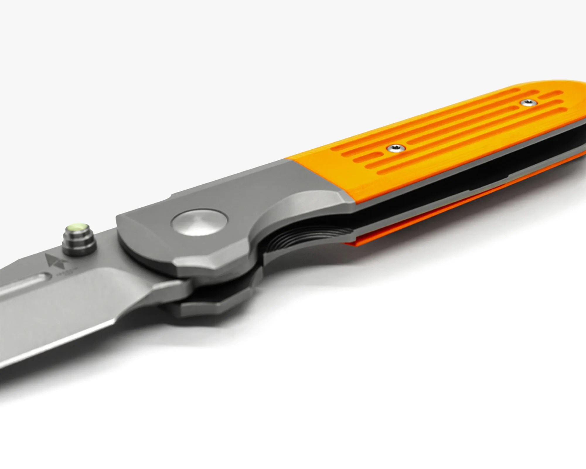 Folding knife with a stainless steel blade and an orange textured handle secured with two screws. The knife features a thumb stud for easy one-handed opening and a visible coil spring mechanism near the pivot.