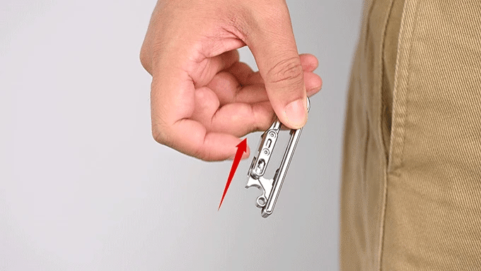 Titaner Titanium Belt Keychain being operated by hand