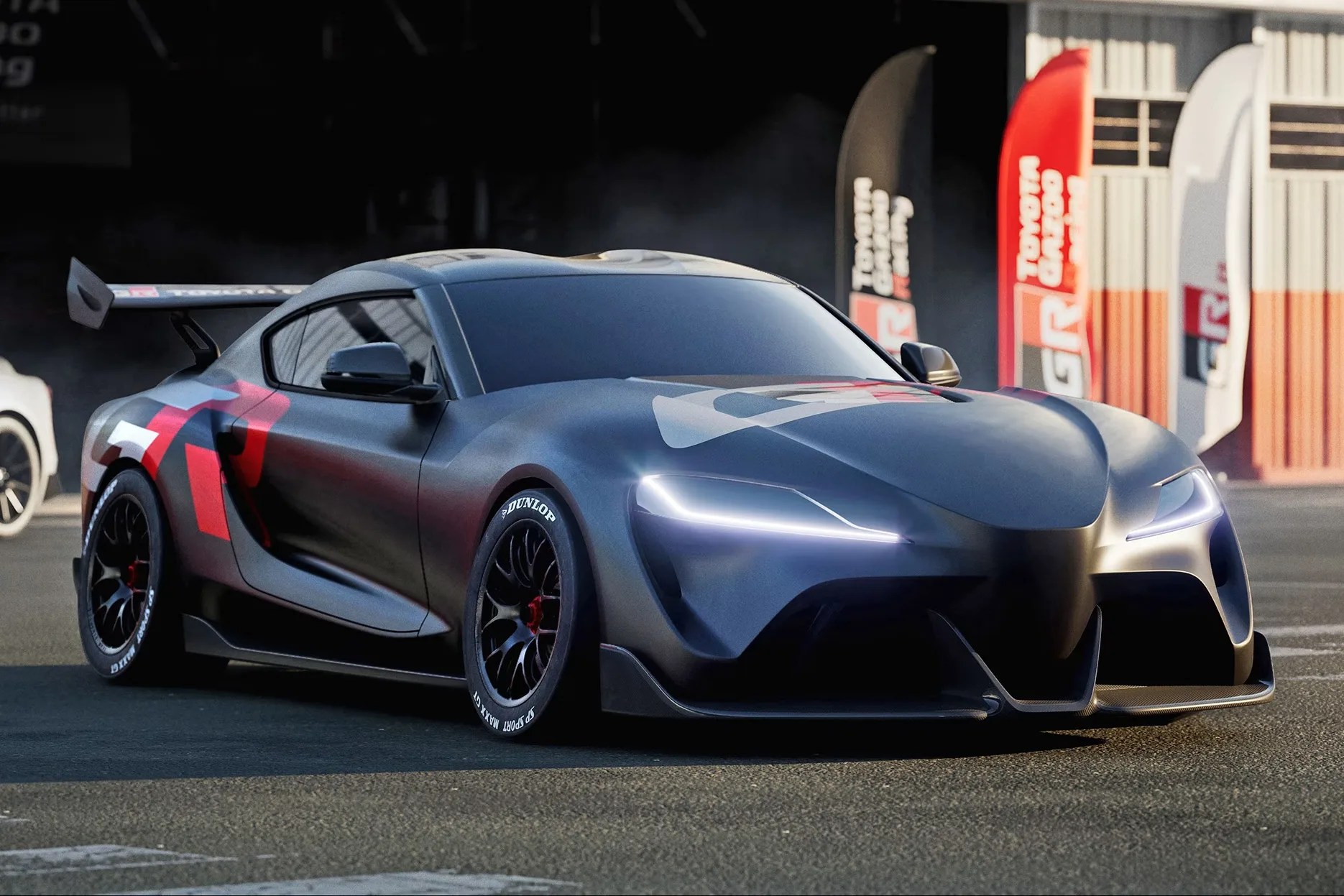 a rendering of a toyota supra race car in front of some race flags
