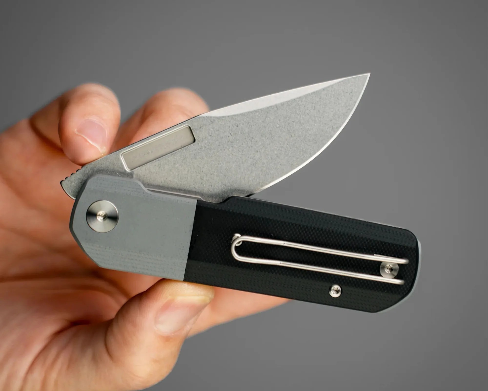 Vero Engineering Avid 1 EDC Knife in hand, half folded