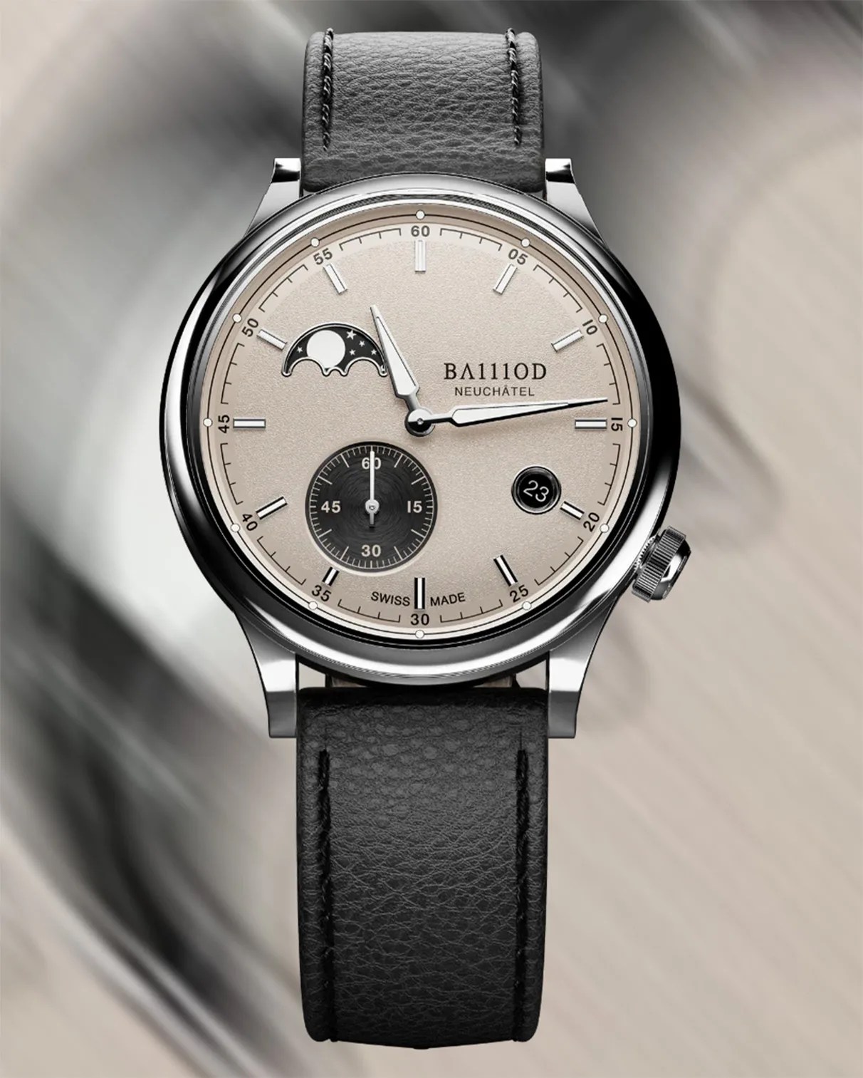 A wristwatch with a silver dial and black leather strap. The watch face features silver hour markers and hands, a moon phase indicator at the 10 o'clock position, a small seconds subdial at the 6 o'clock position, and a date window at the 4 o'clock position displaying the number 23. The brand name "BA111OD" and "NEUCHÂTEL" are printed on the dial, along with "SWISS MADE" at the bottom. The watch case is polished silver with a crown on the right side.